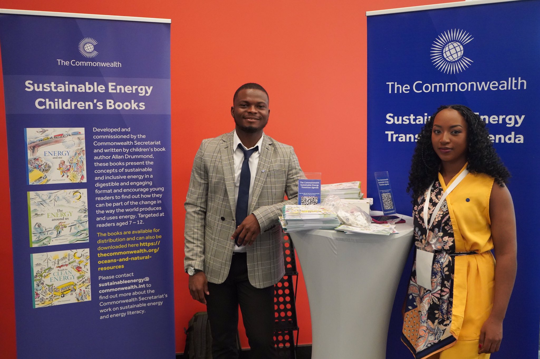 Jeremiah Thoronka and Delicia Mwanyika, two Commonwealth youth leaders in the sustainable energy sector, presenting the books at the Commonwealth stand at the SEForAll Forum