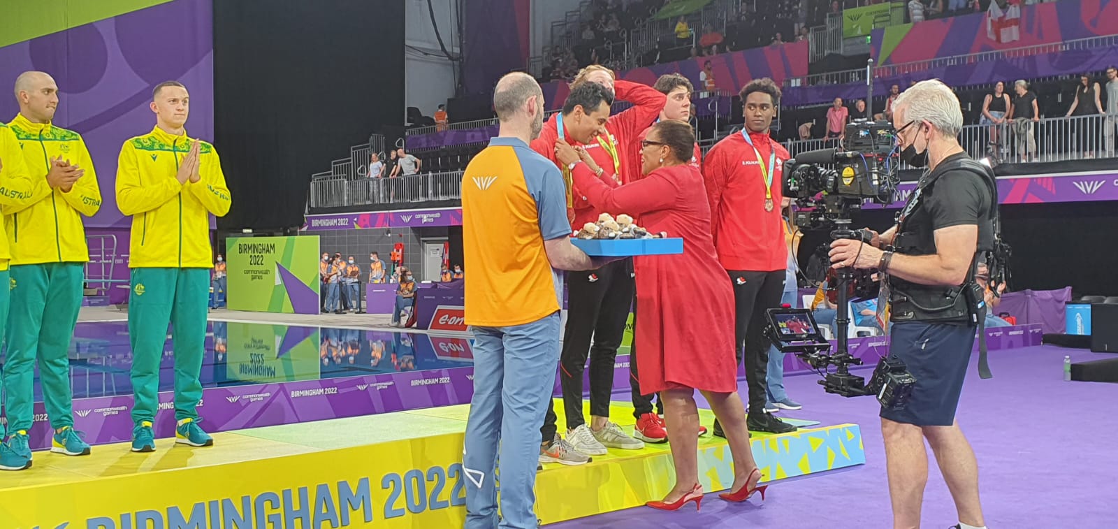 Commonwealth Secretary-General, Patricia Scotland, presenting medals in the Men's 4x100m Freestyle race