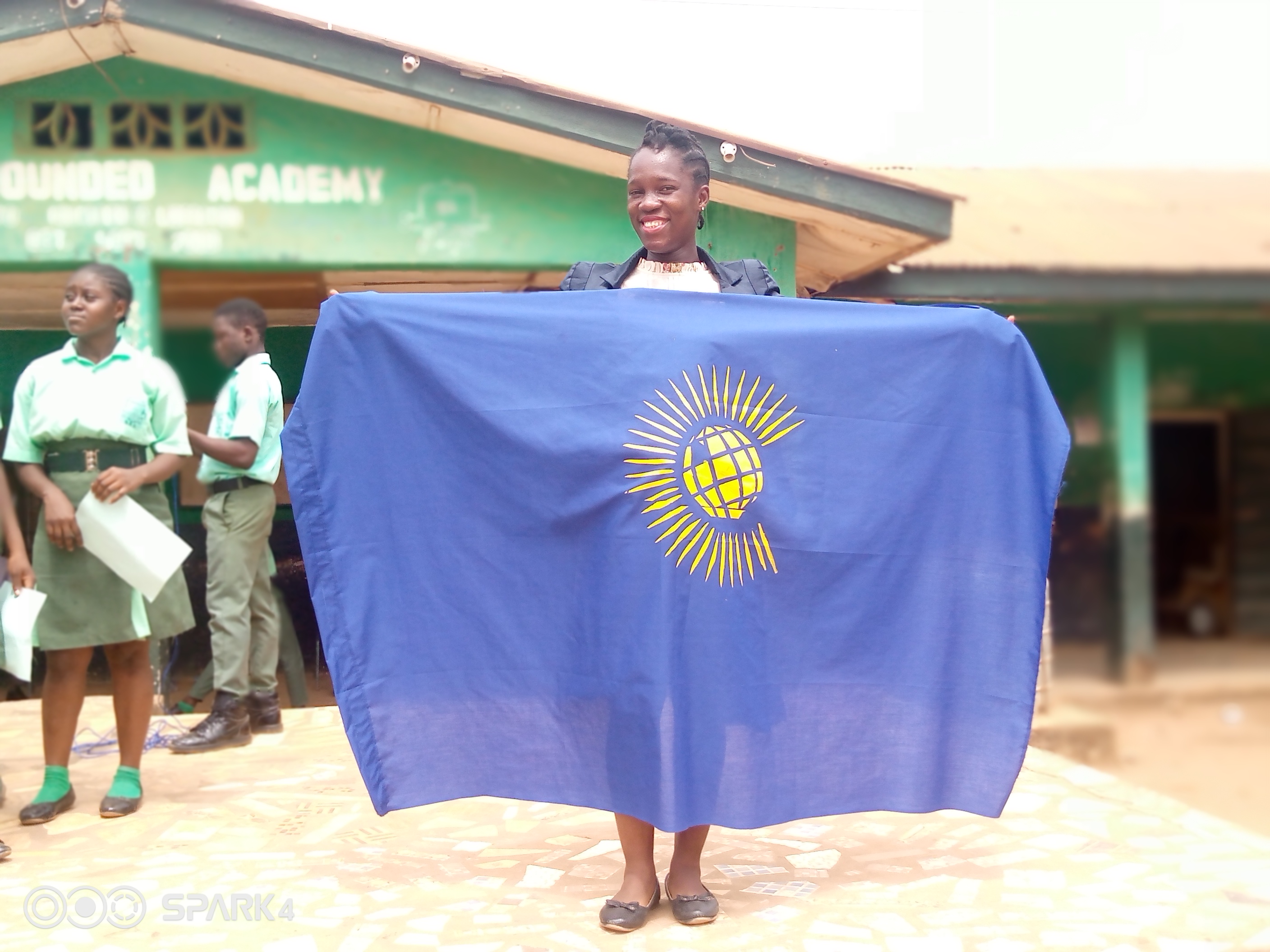 Lamzy Jarret from Sierra Leone holding the Commonwealth Flag for Peace