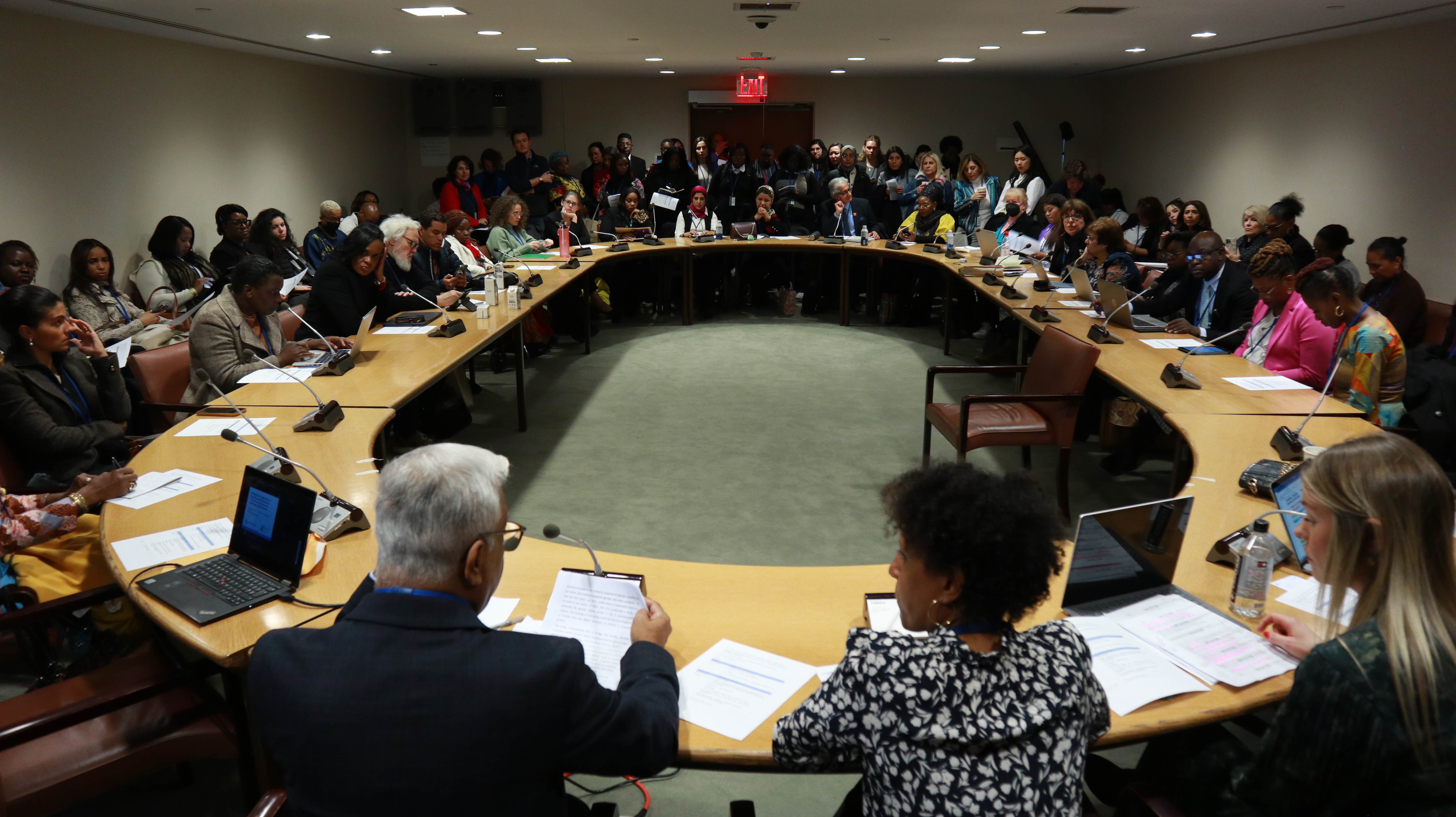 Participants sitting around a table for a discussion on ‘Bridging the digital gap for women-led businesses in developing economies’.