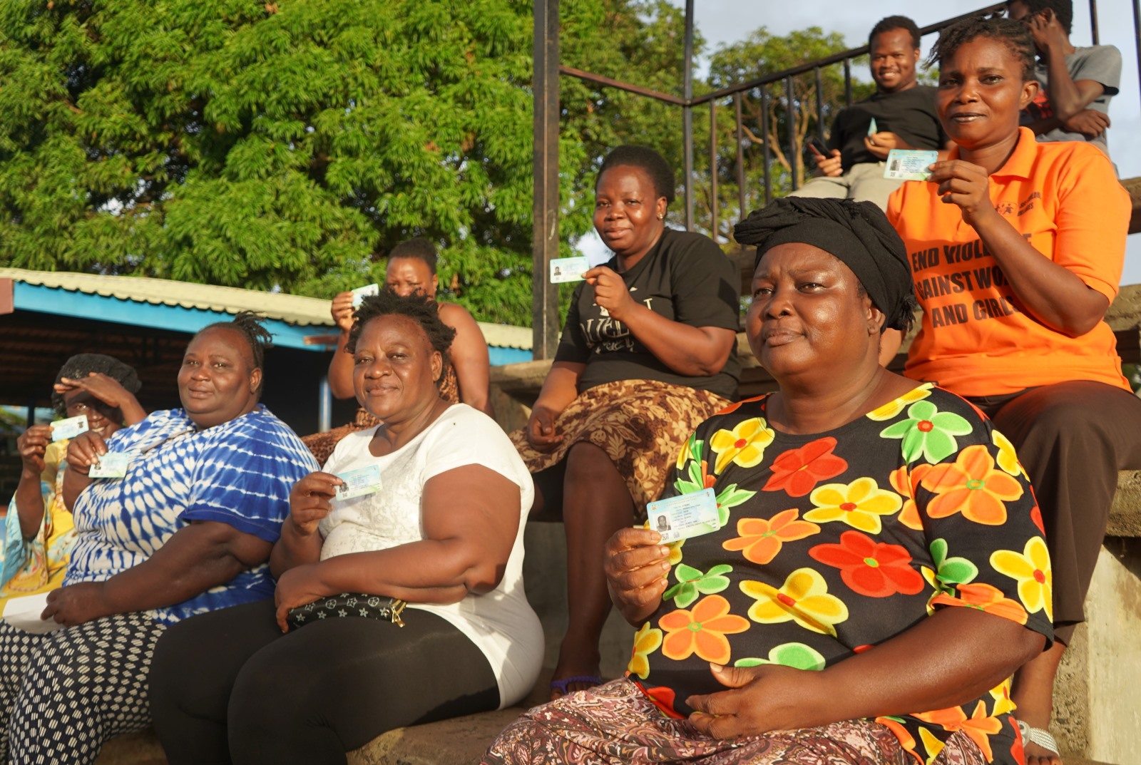 Women holding their id cards