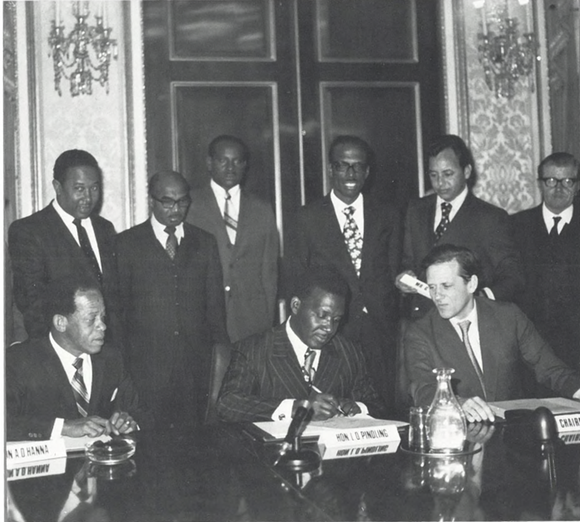 Prime Minister, the Hon. Lynden O. Pindling is shown above centre signing the report of the Constitutional Conference, which ended at Marlborough House in London on 20 December 1972. 