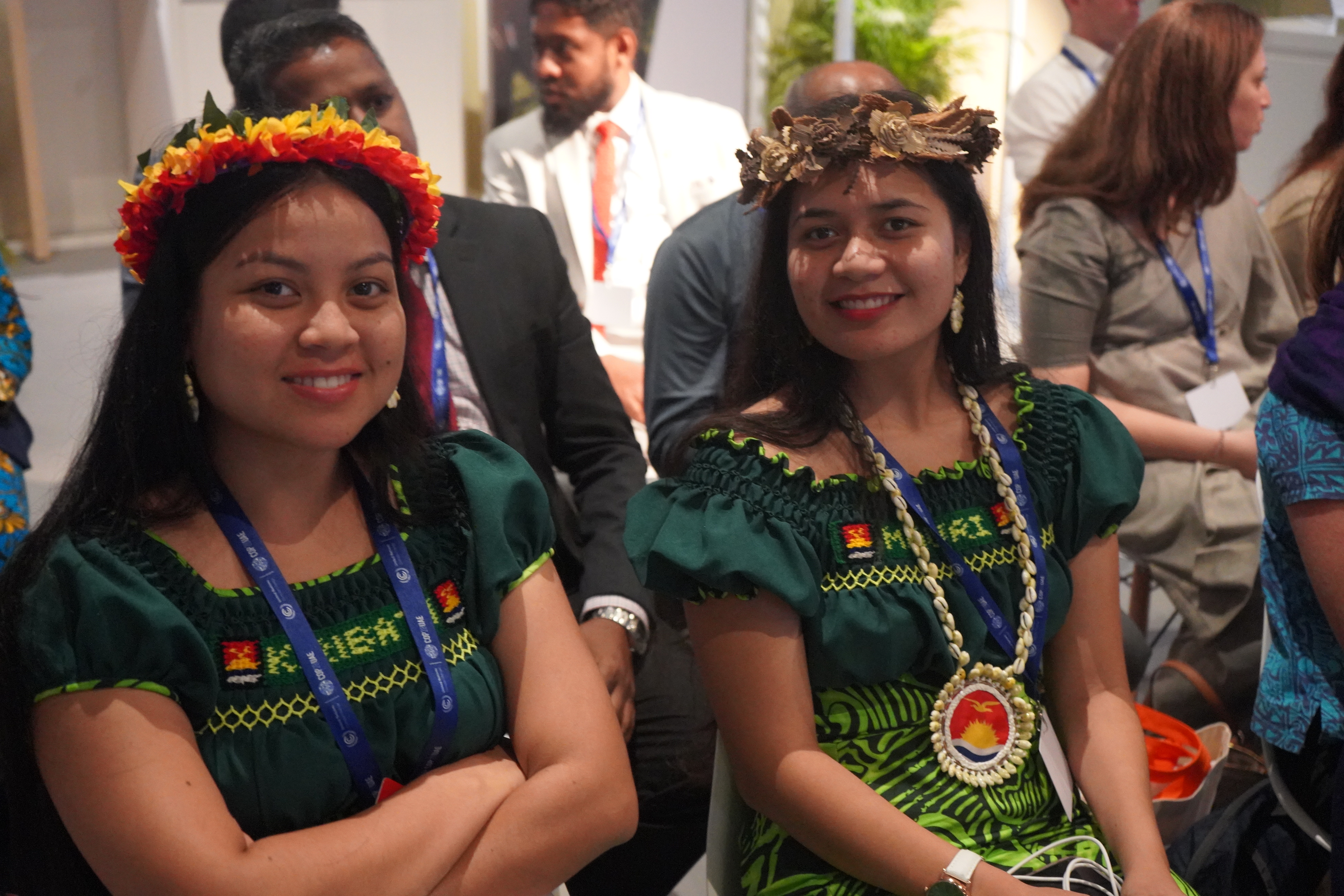 Two people from Kiribati attend an event at the Commonwealth Pavilion at COP28