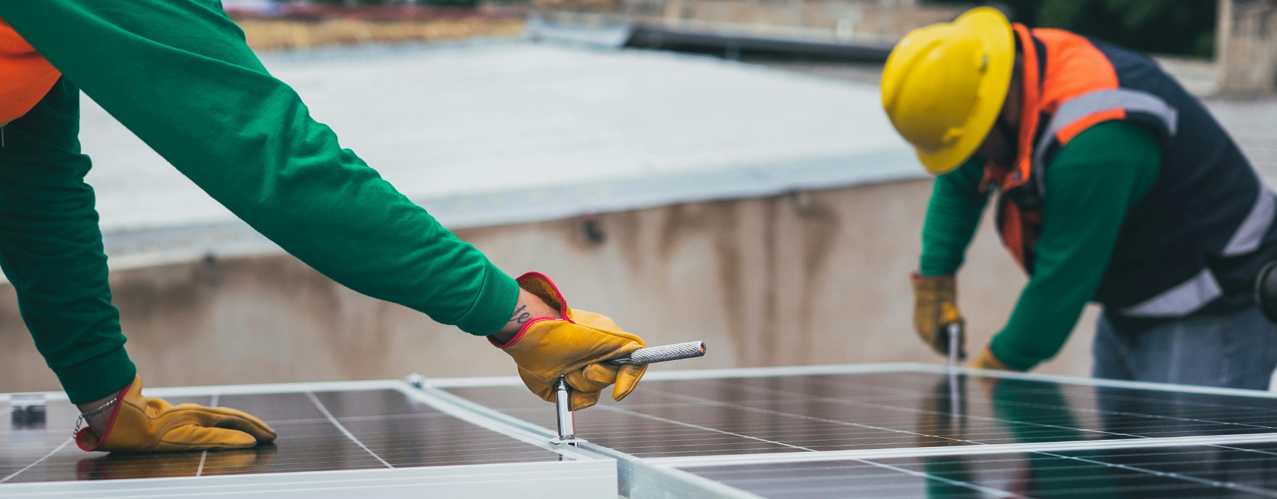 Electricians working on solar panels 