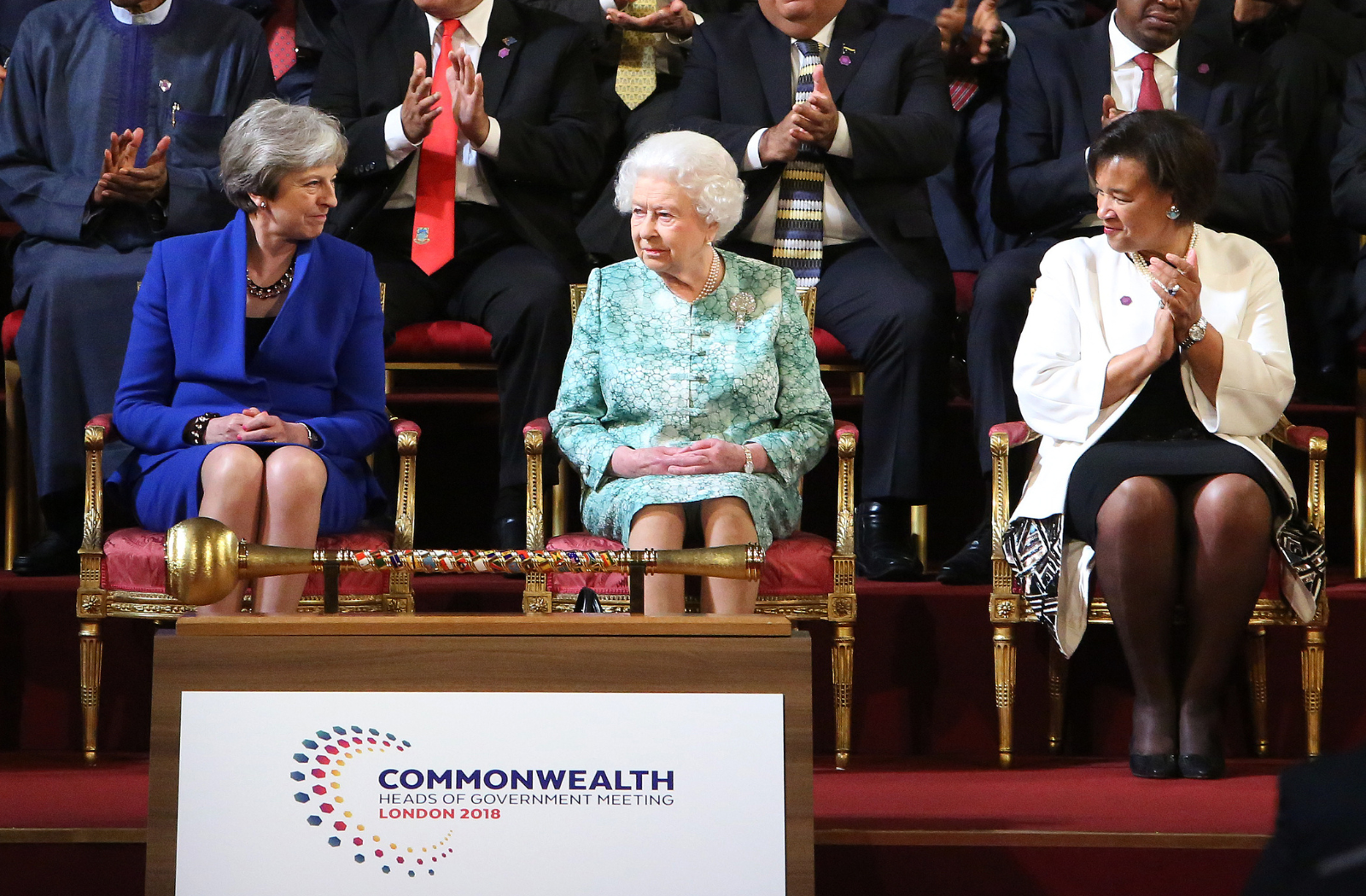 Her Late Majesty Queen Elizabeth II, former Prime Minister of the United Kingdom, Theresa May, and the Commonwealth Secretary-General, the Rt Hon Patricia Scotland KC, at the opening ceremony of CHOGM 2018