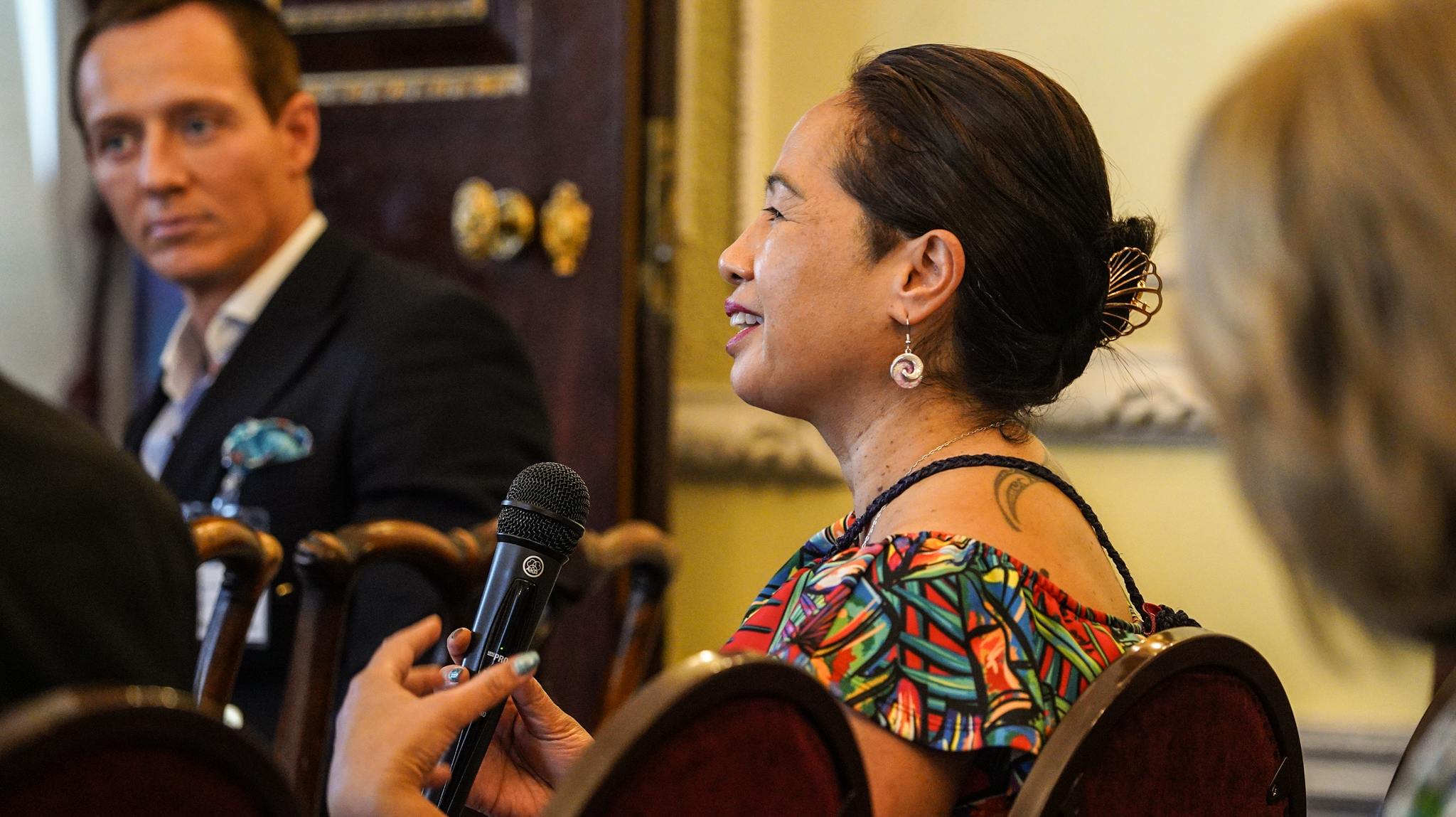 female-guest-speaks-to-panel