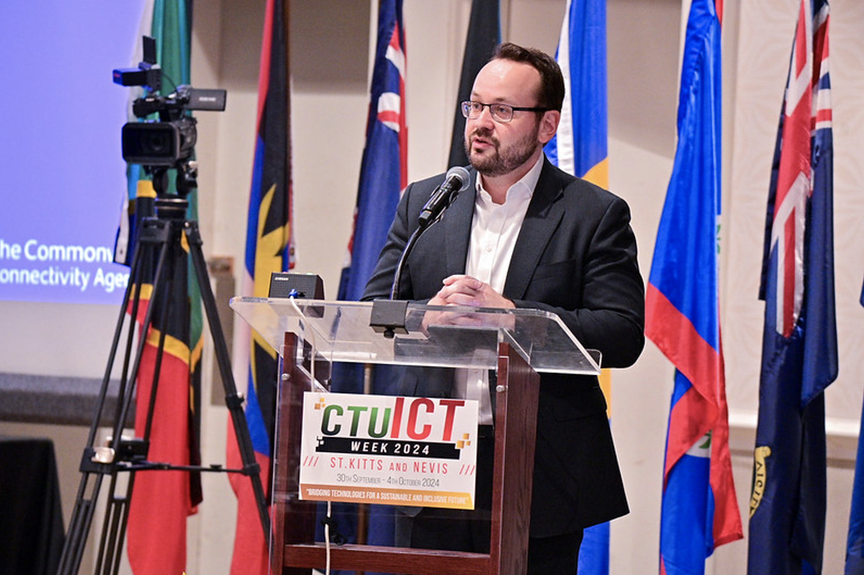 Man giving speech on podium