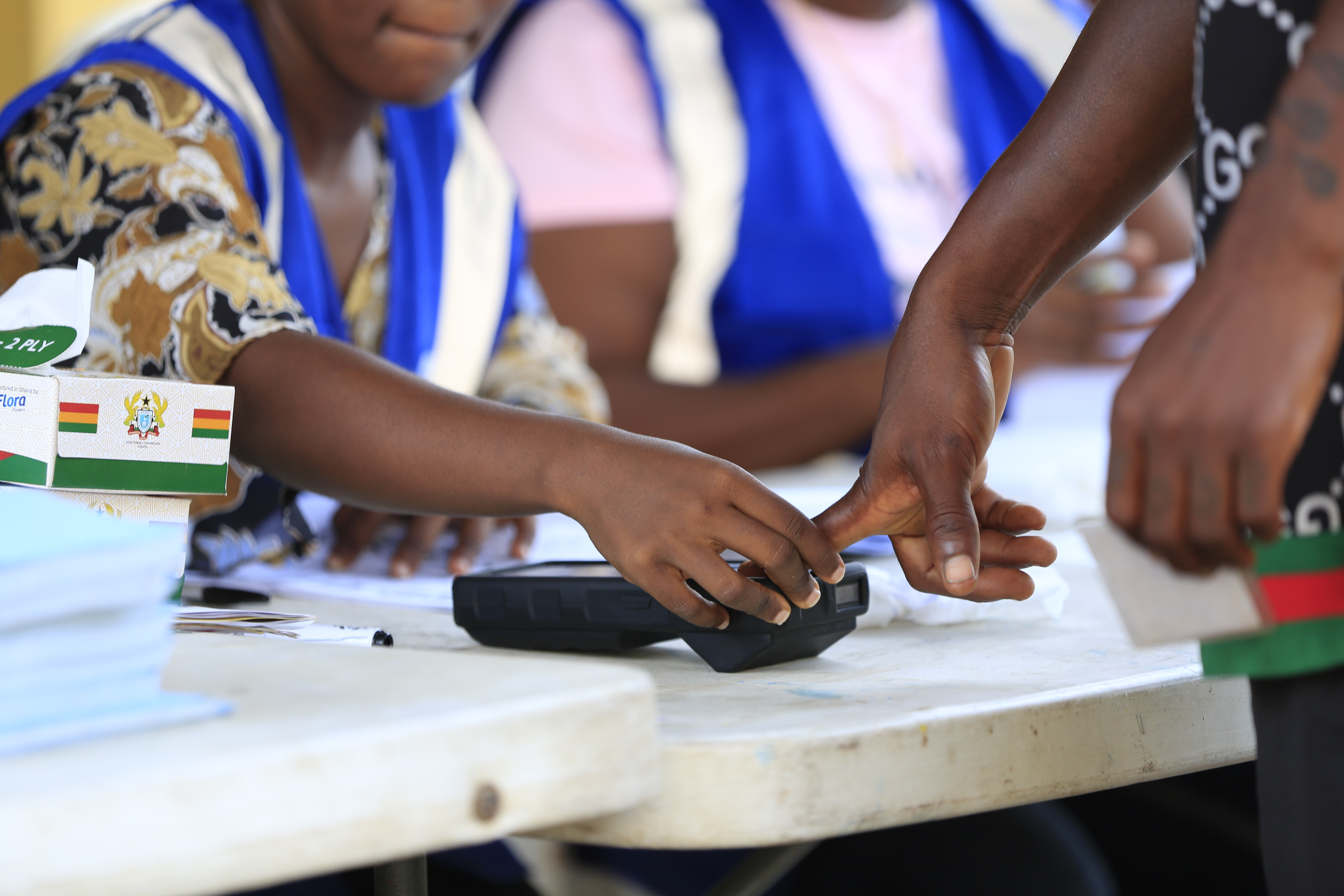 Voter with polling officials