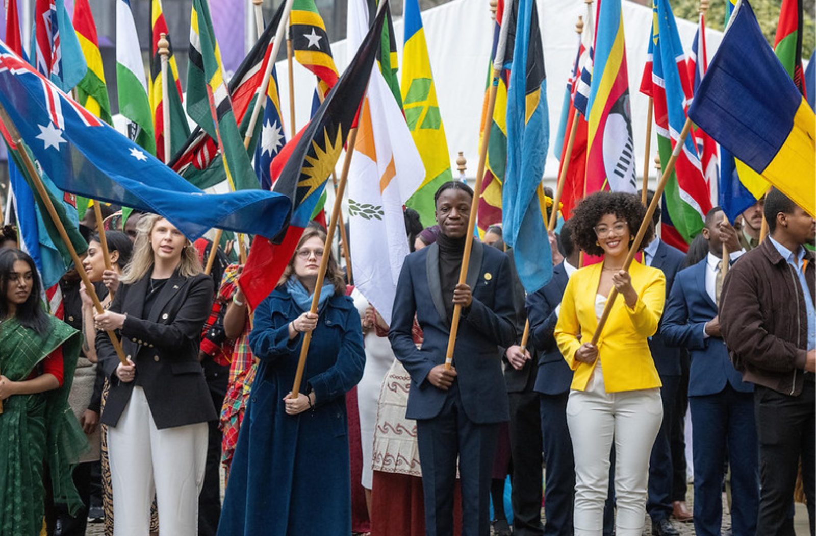 Youth holding flags of Commonwealth countries