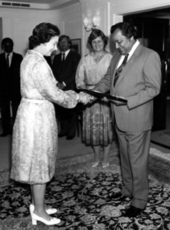 Commonwealth Secretary-General Shridath Ramphal, receiving the order of Australia from HM Queen Elizabeth II on board the Royal Yacht Brittania, Brisbane, Australia.