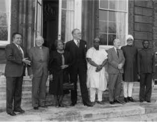 Commonwealth Eminent Persons Group (EPG), Marlborough House, London, 1986: L-R: Commonwealth Secretary-General Shridath Ramphal, Archbishop Edward Scott, Dame Nita Barrow, Malcolm Fraser, General Olusegun Obasanjo, Lord Barber of Wentbridge, Sarsar Swaran Singh, John Malecela.