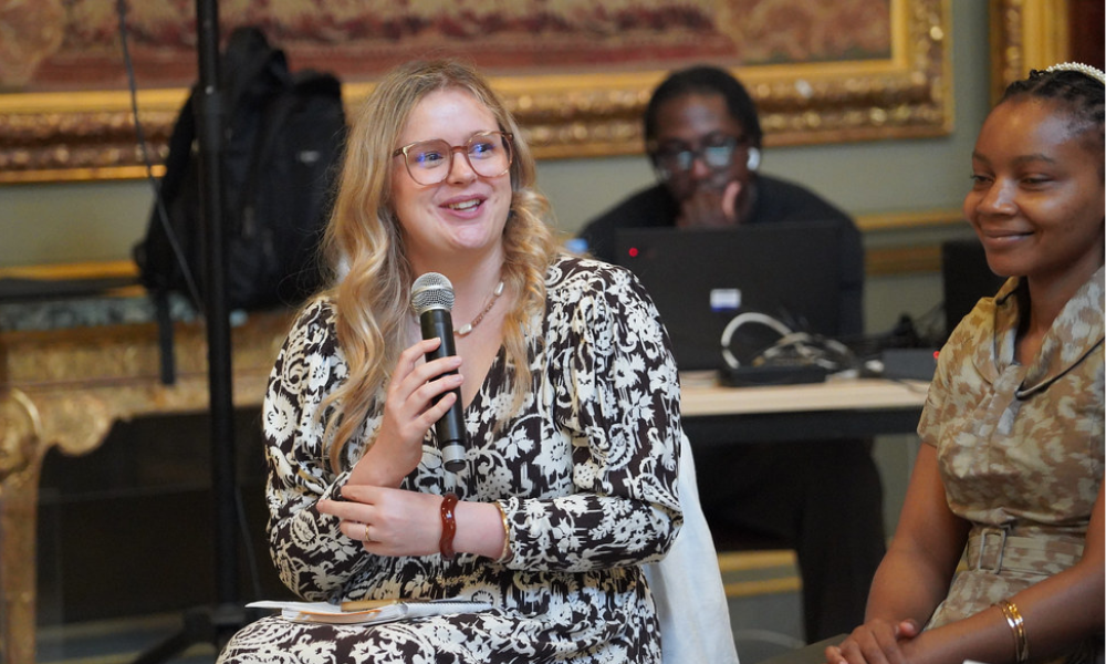 Emily Gilmour, Health Officer, speaking into a microphone