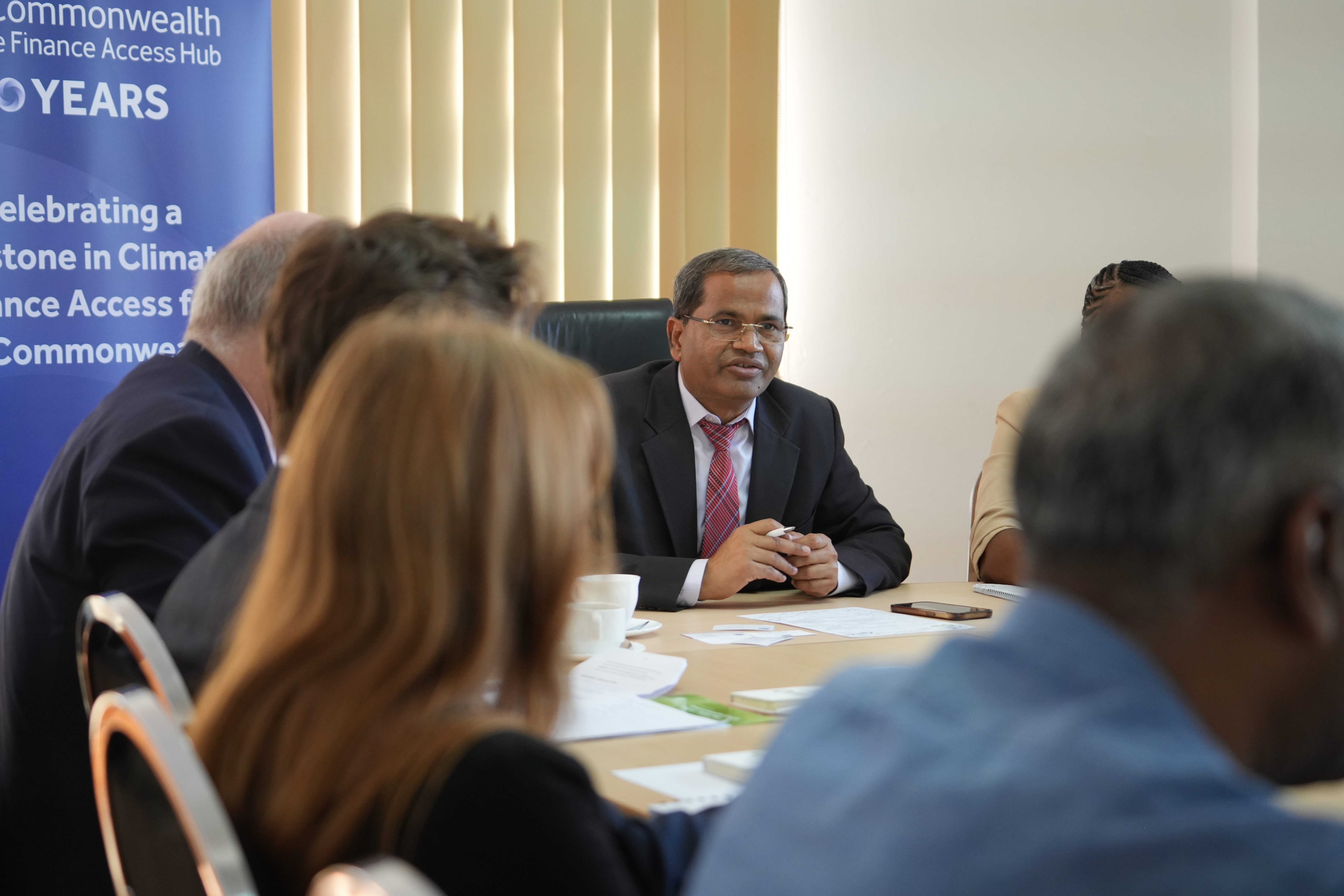 Suresh in talking at a table