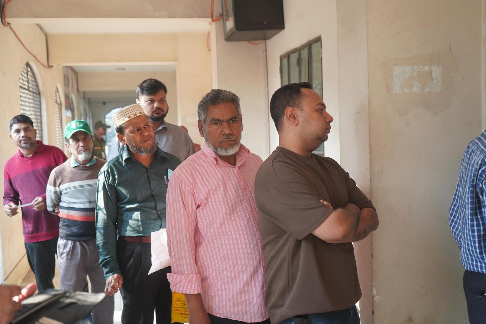People queuing to vote