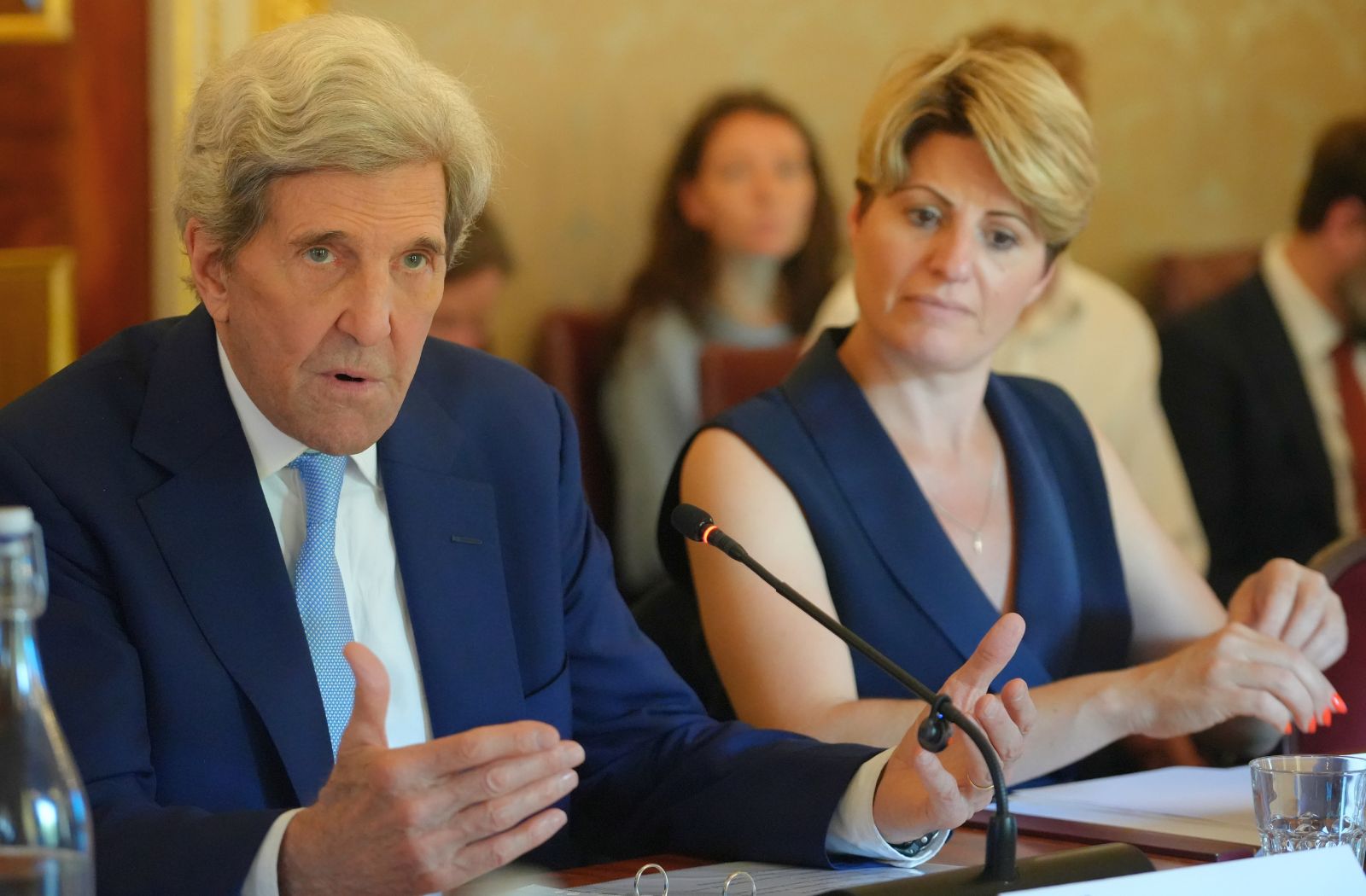 Secretary John Kerry speaks into a microphone