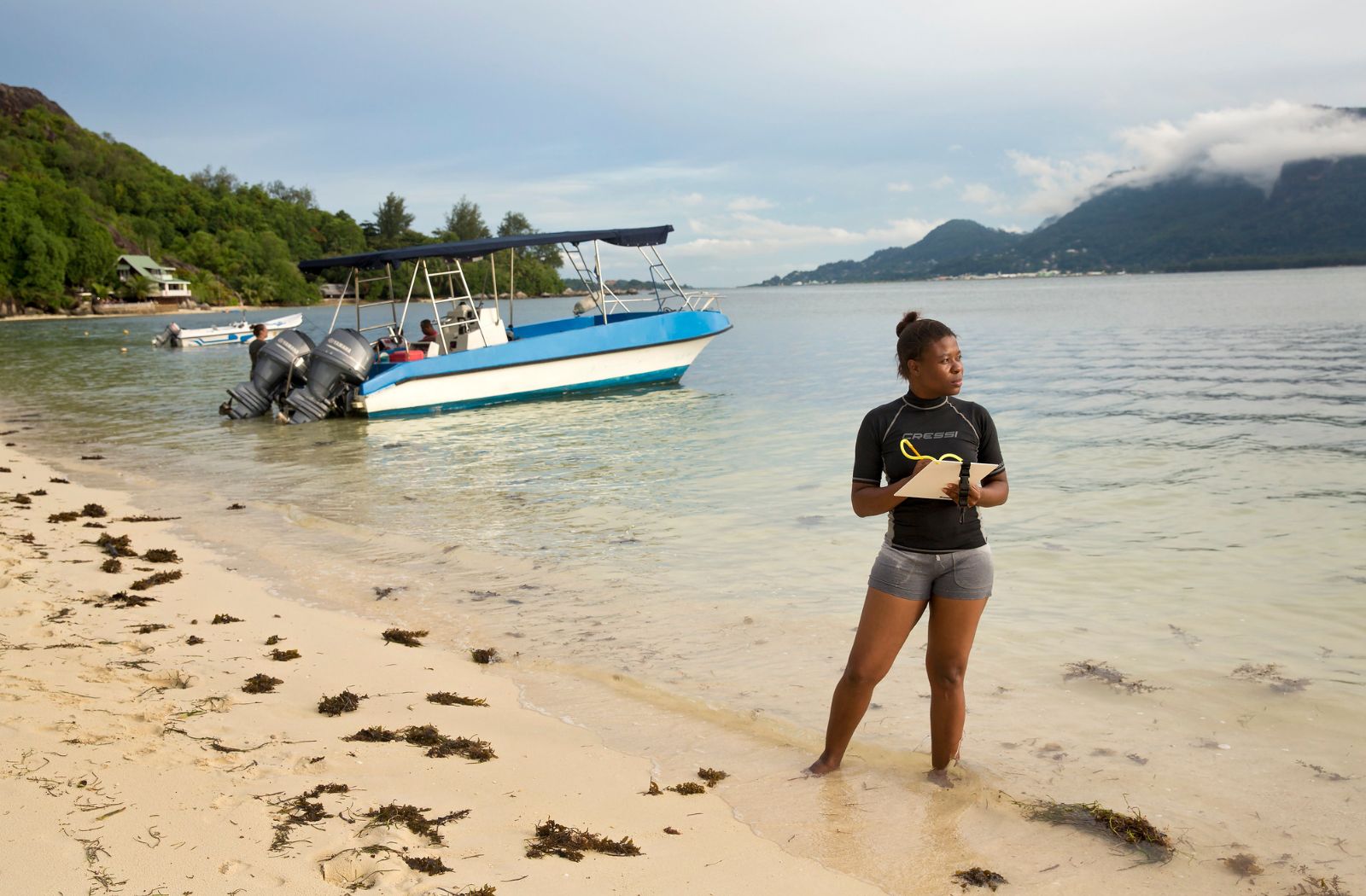 A woman maps coral reefs around Mahe Island in Seychelles
