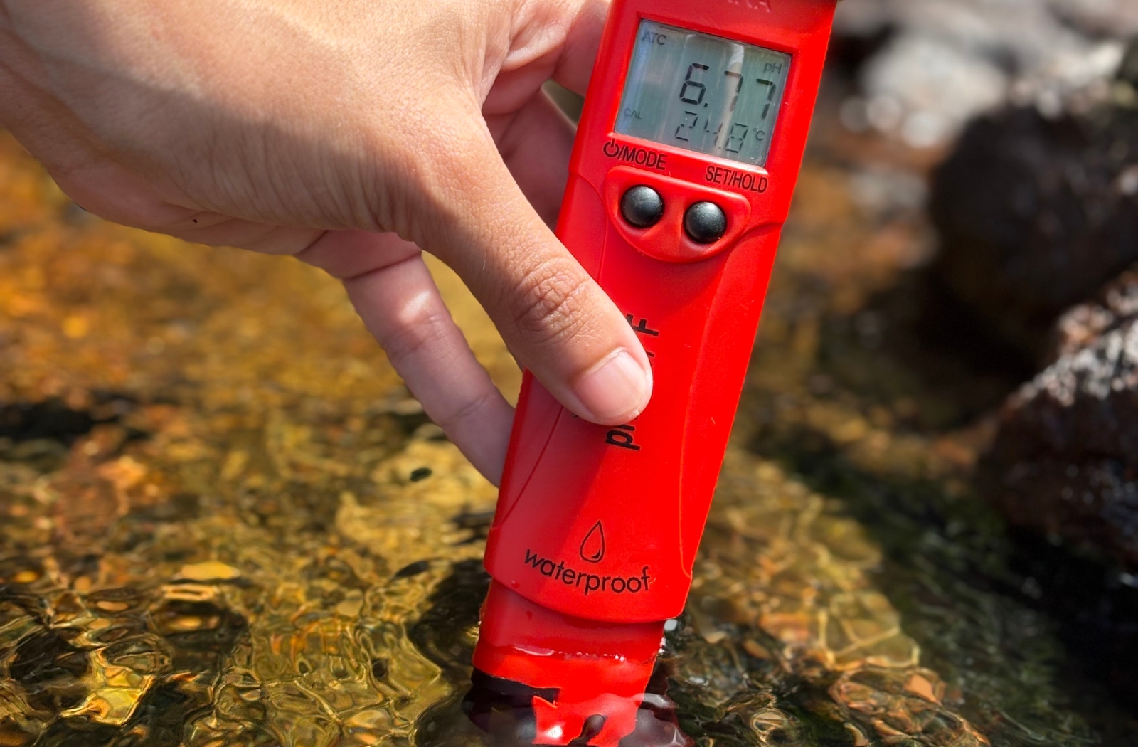 River testing for plastic in Seychelles