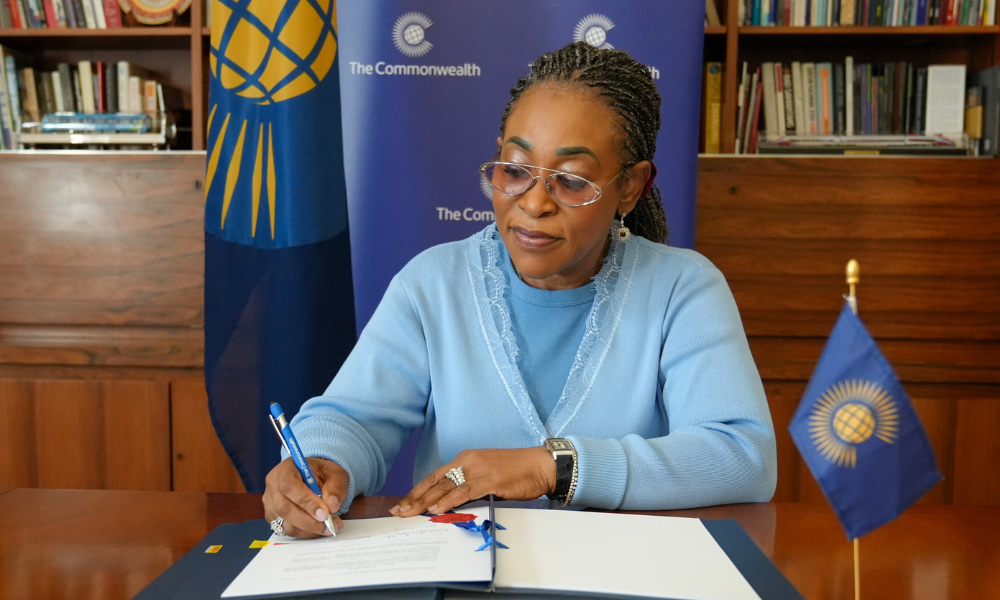 Commonwealth Secretary-General Shirley Botchwey signing the Commonwealth-WHO MoU