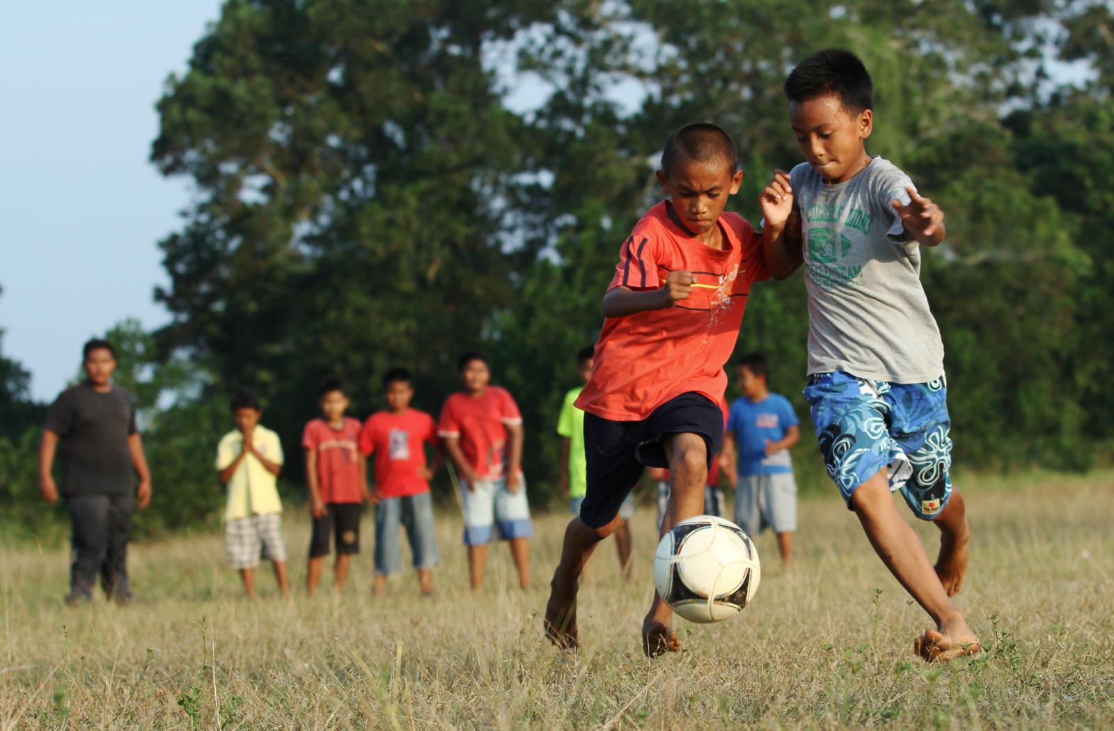 Children playing football in Malaysia