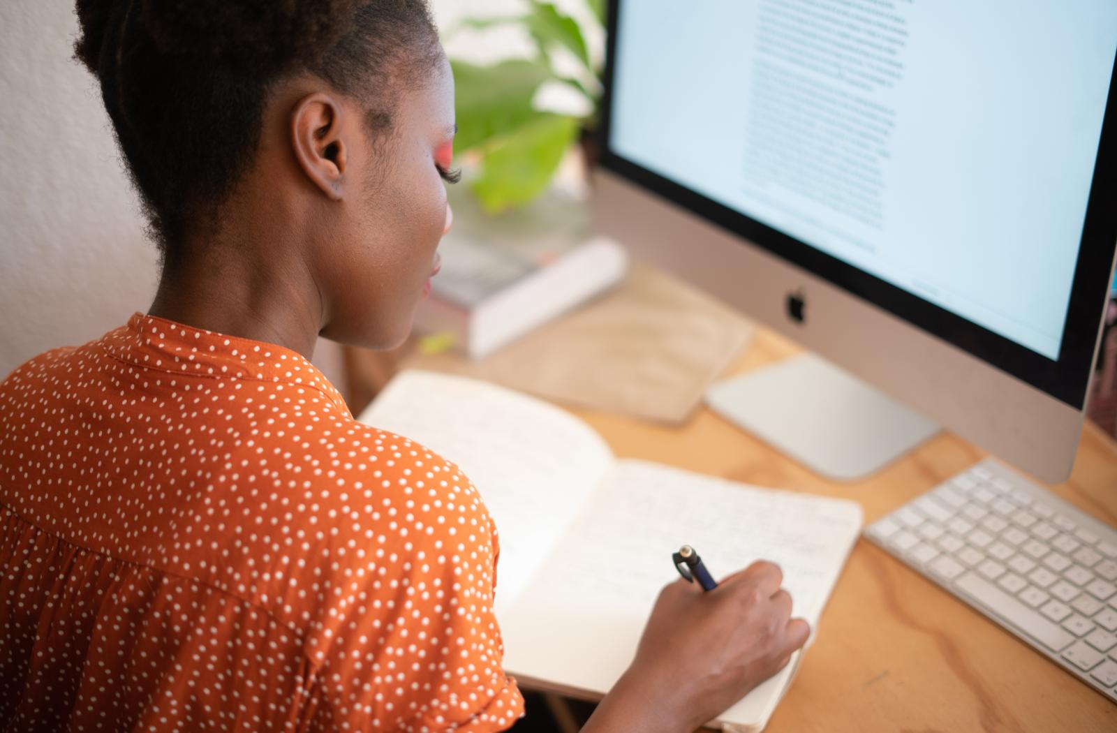 Woman writing in notebook
