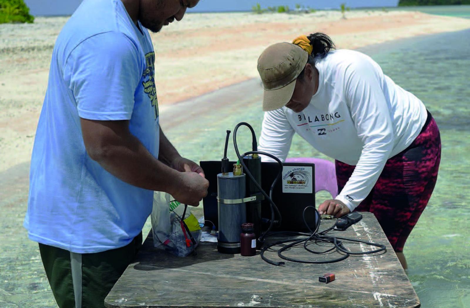 Two researchers monitoring ocean acidification in the Pacific Islands 