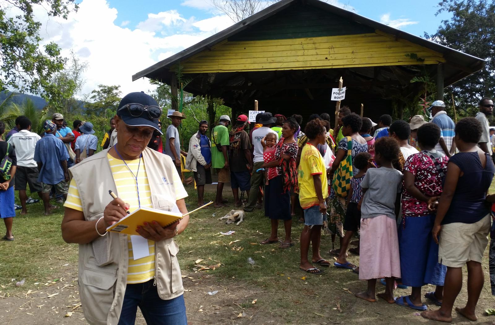 Member of the COG writing down notes