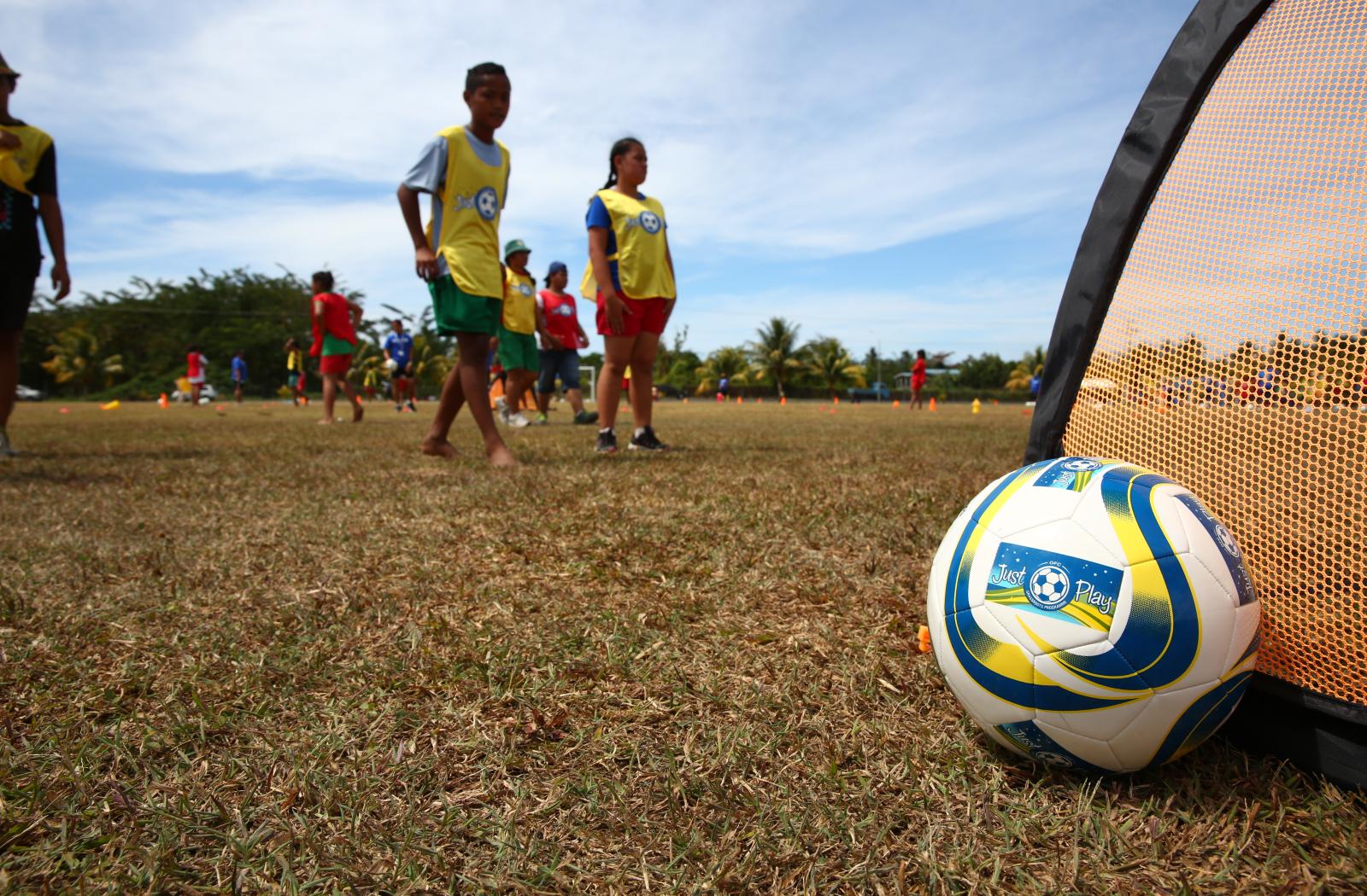 Football with players in background