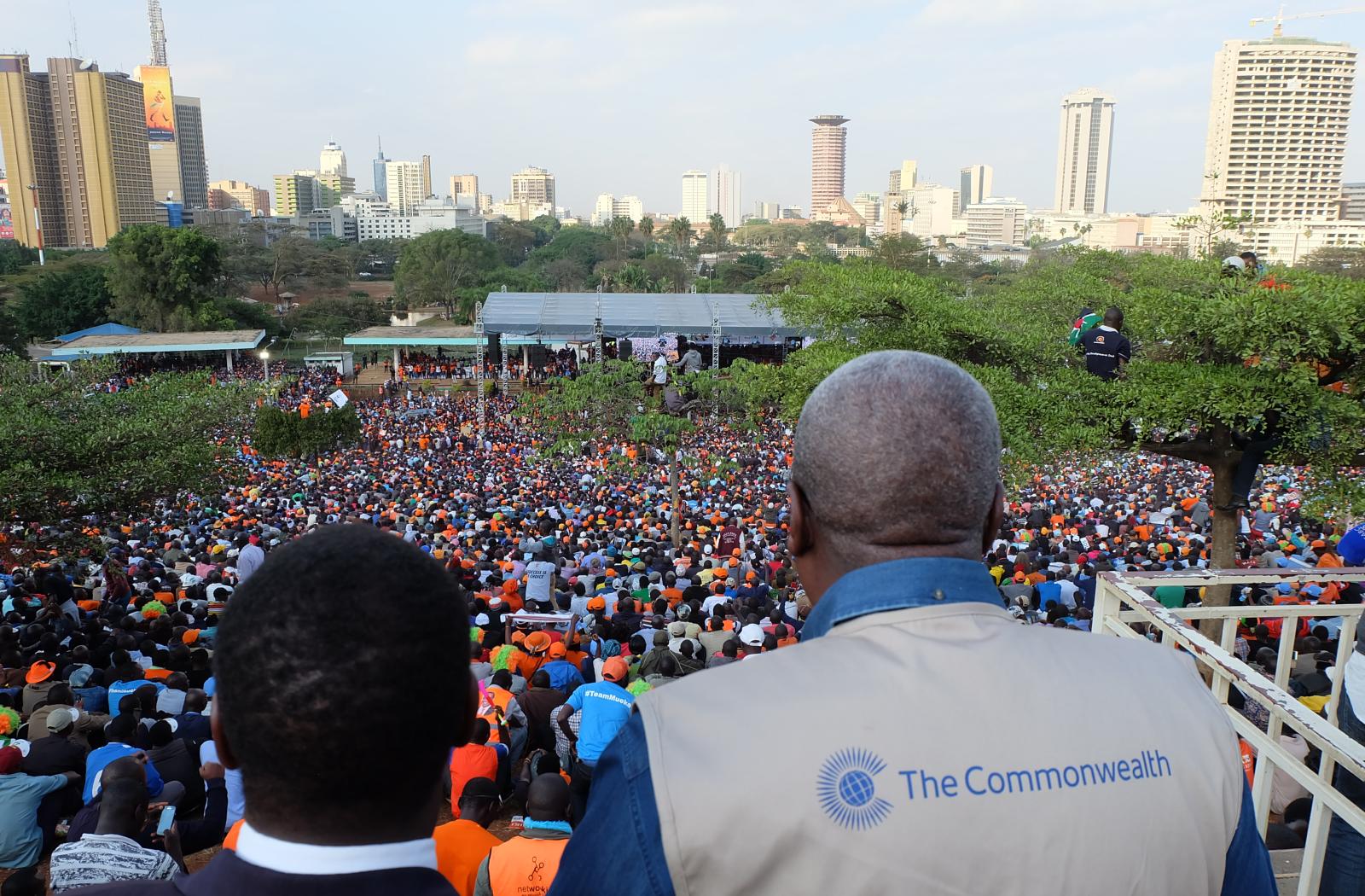 COG members looking over a crowd of people in Kenya