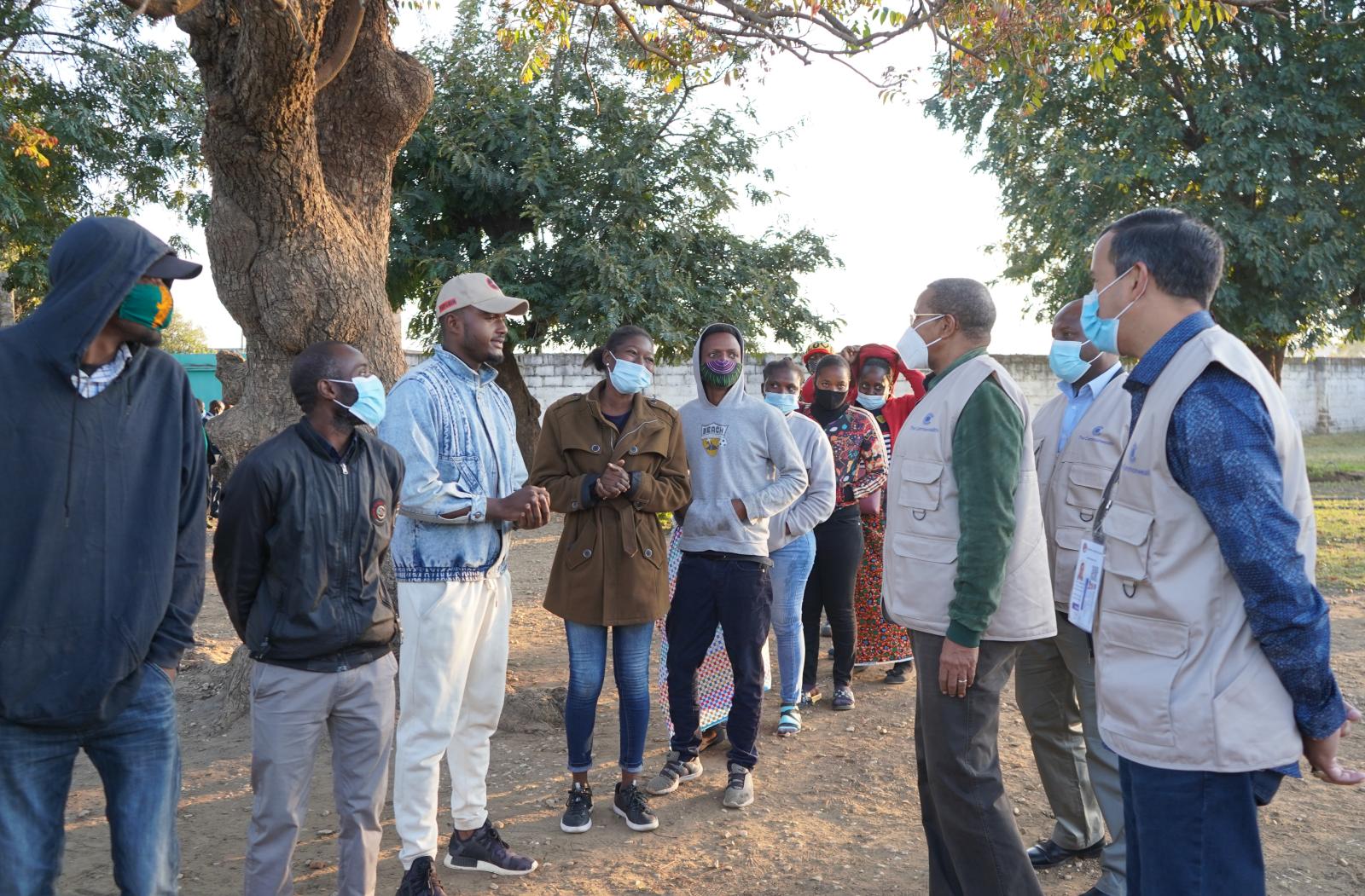 People wait to cast their vote in the 2021 general elections in Zambia