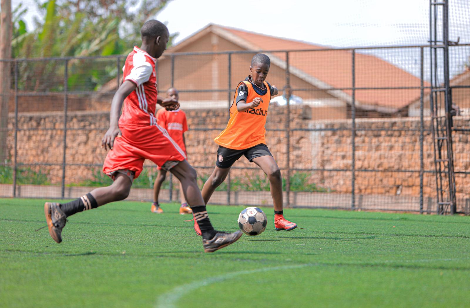 Two boys playing football