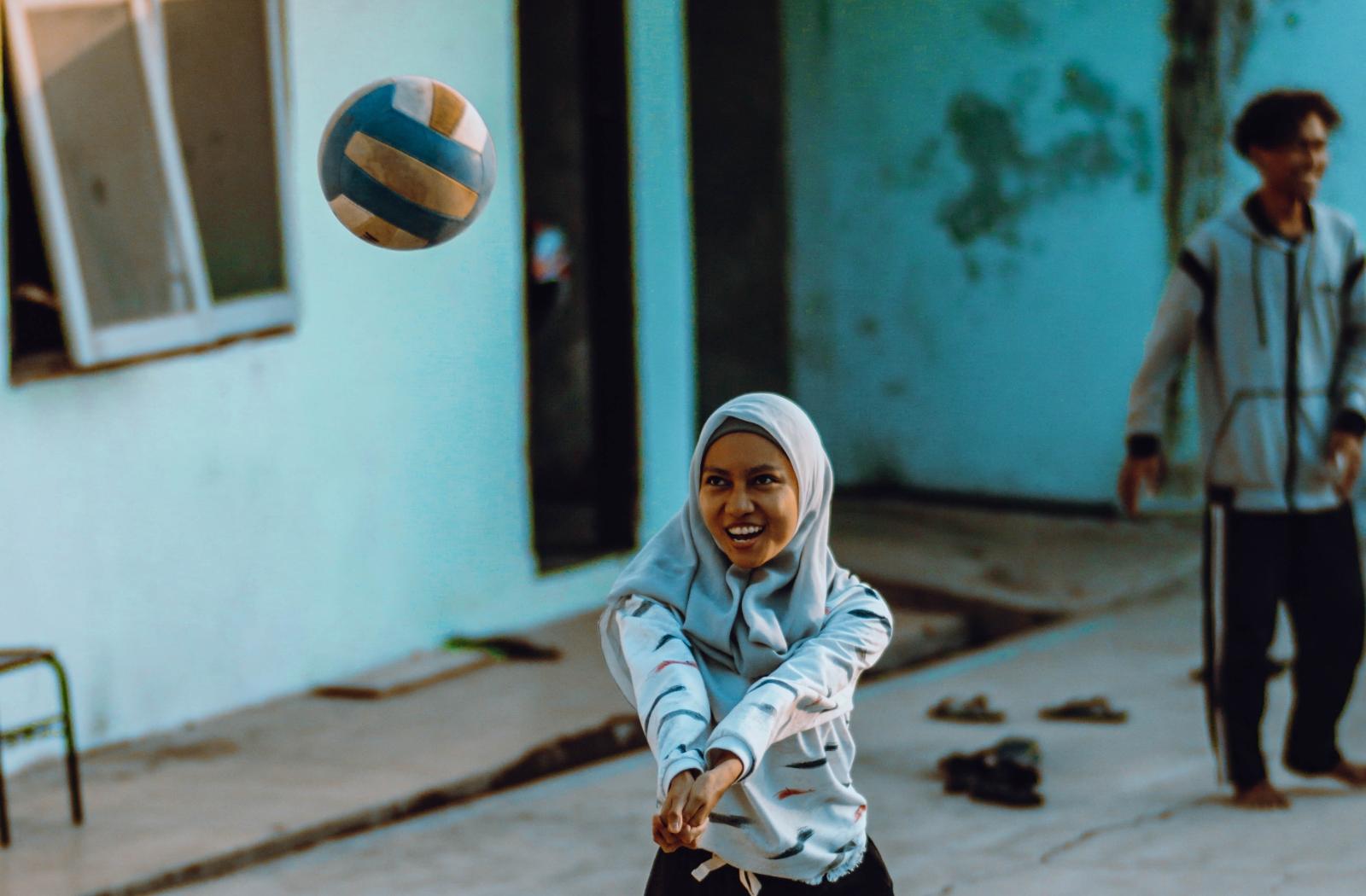 A girl playing volleyball