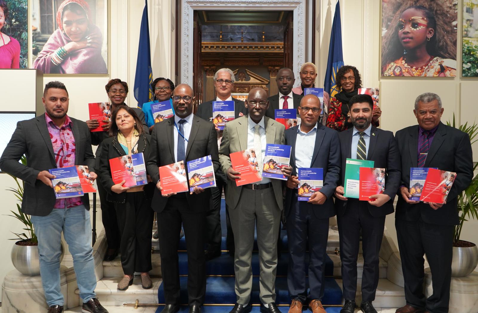 Group photo of stakeholders with publications