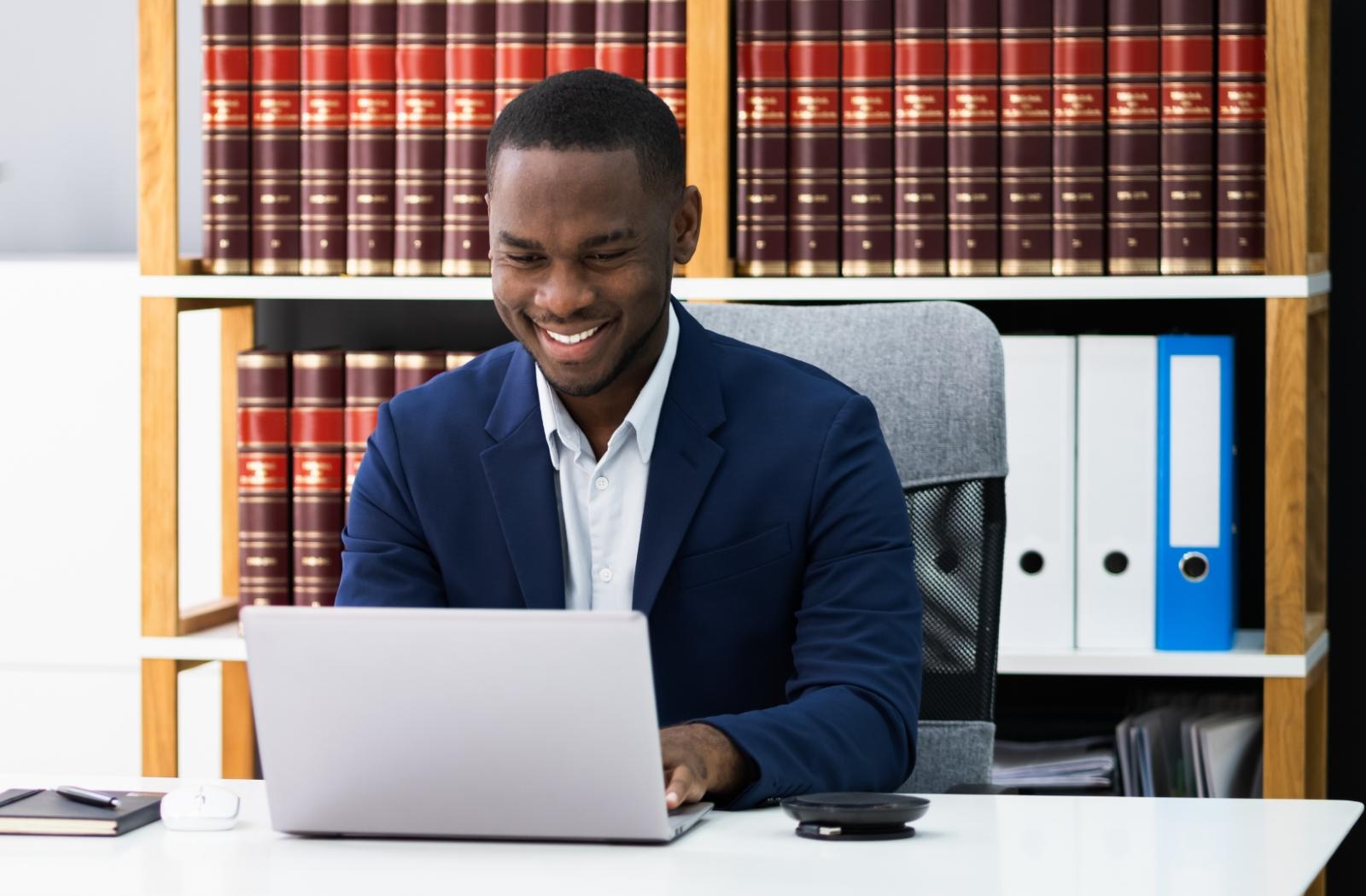 lawyer at desk with laptop