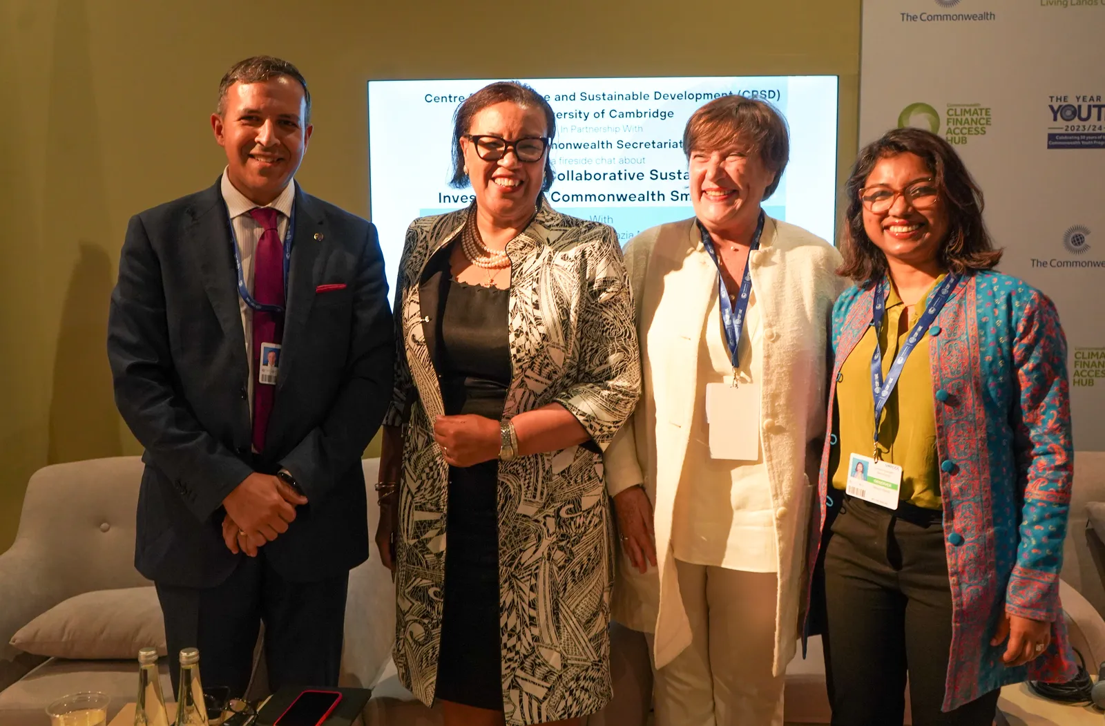 A group photo of the panel of speakers at the COMPASS event