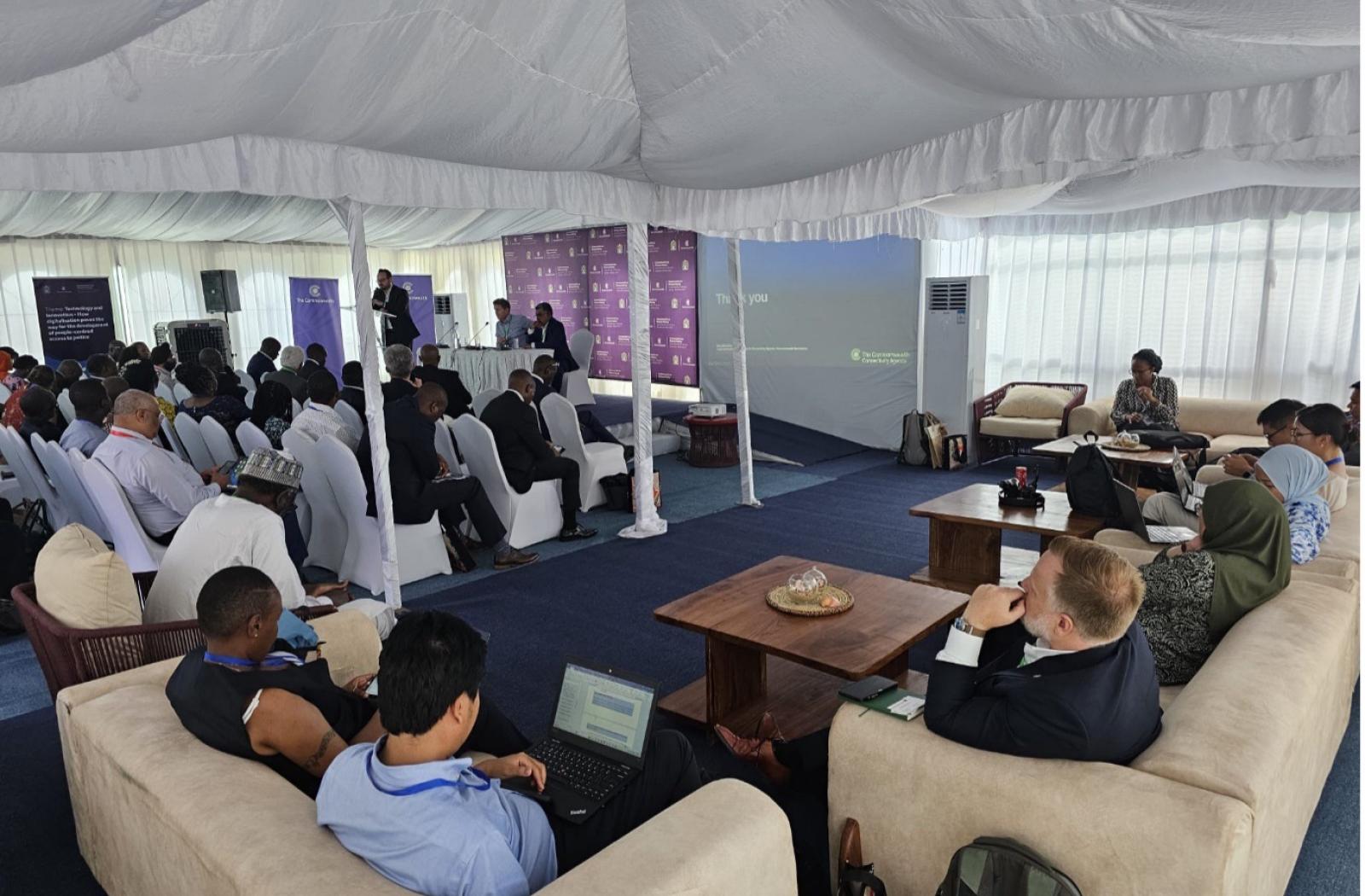 A speaker gives a presentation at the Connectivity Agenda event at Commonwealth Law Ministers Meeting in Zanzibar