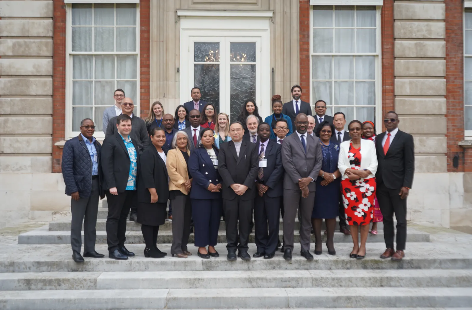 Family photo of delegates at CACH in London