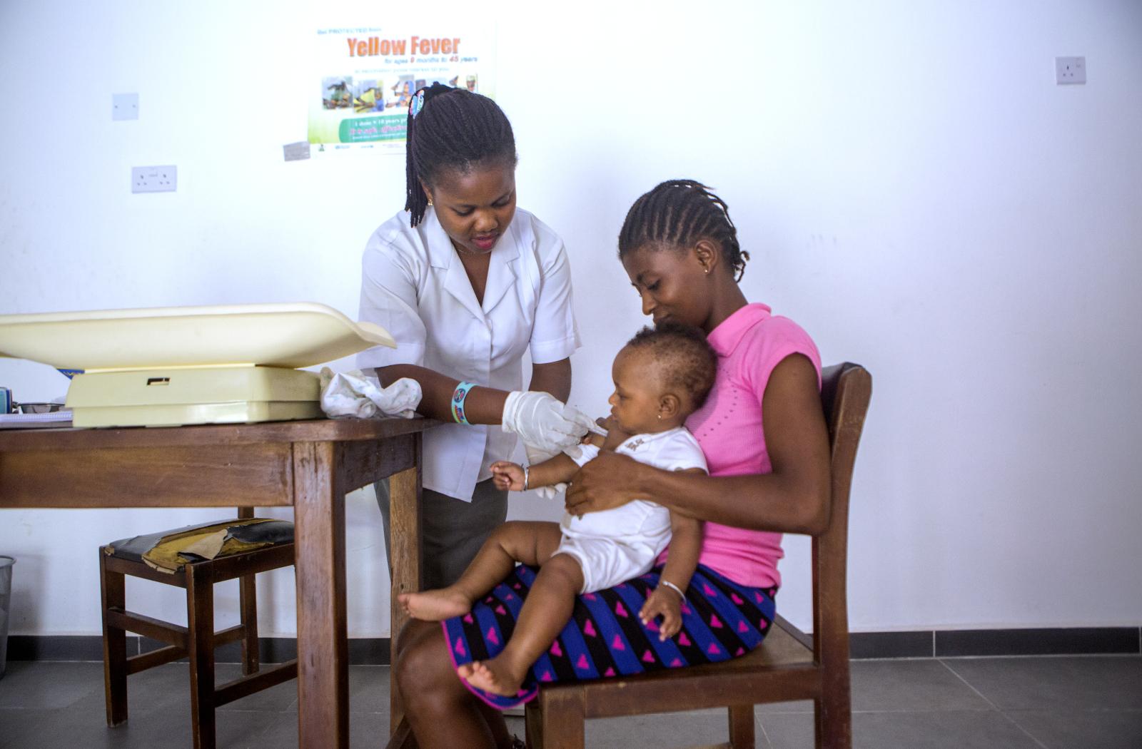 A health worker performs a rapid diagnostic test for malaria on a child (MNMUK)
