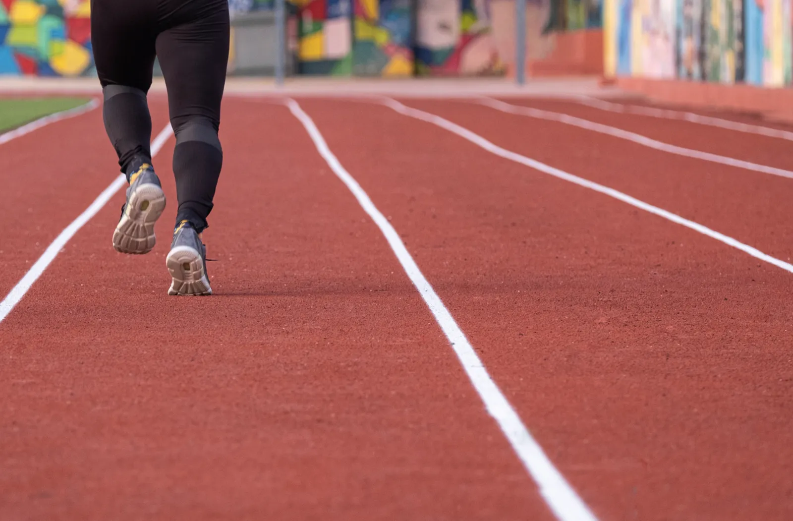Person running on a track