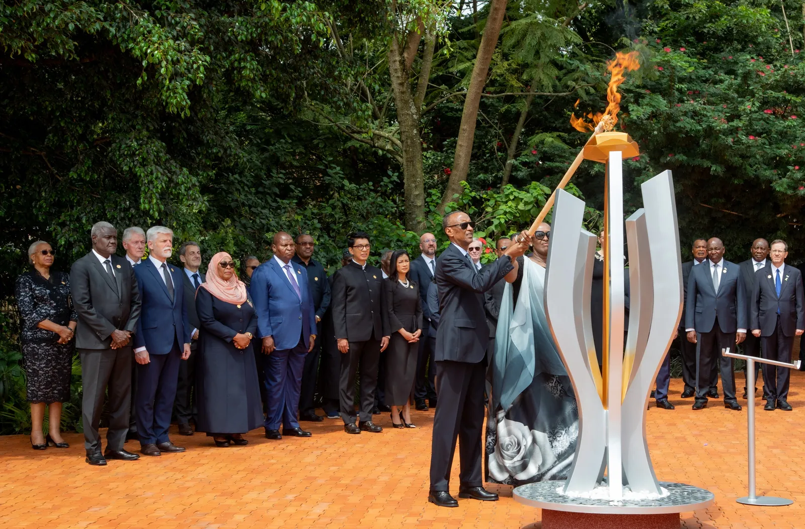 Rwandan President Paul Kagame lights a memorial flame at the Kigali Genocide Memorial