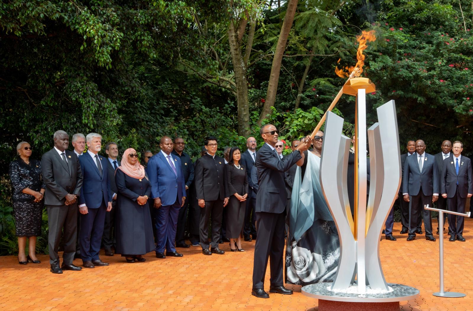 Rwandan President Paul Kagame lights a memorial flame at the Kigali Genocide Memorial