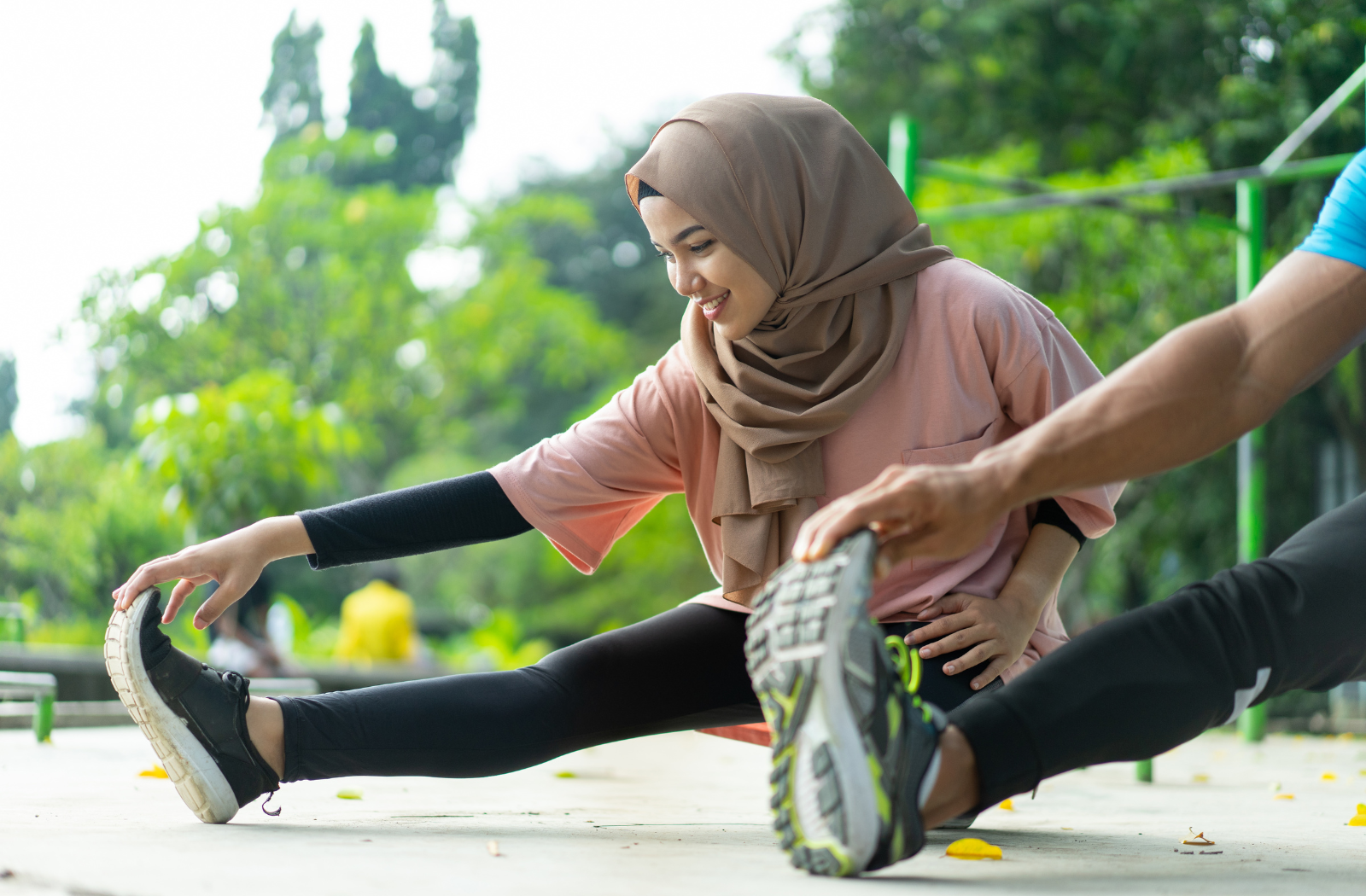 Two people stretching before exercise