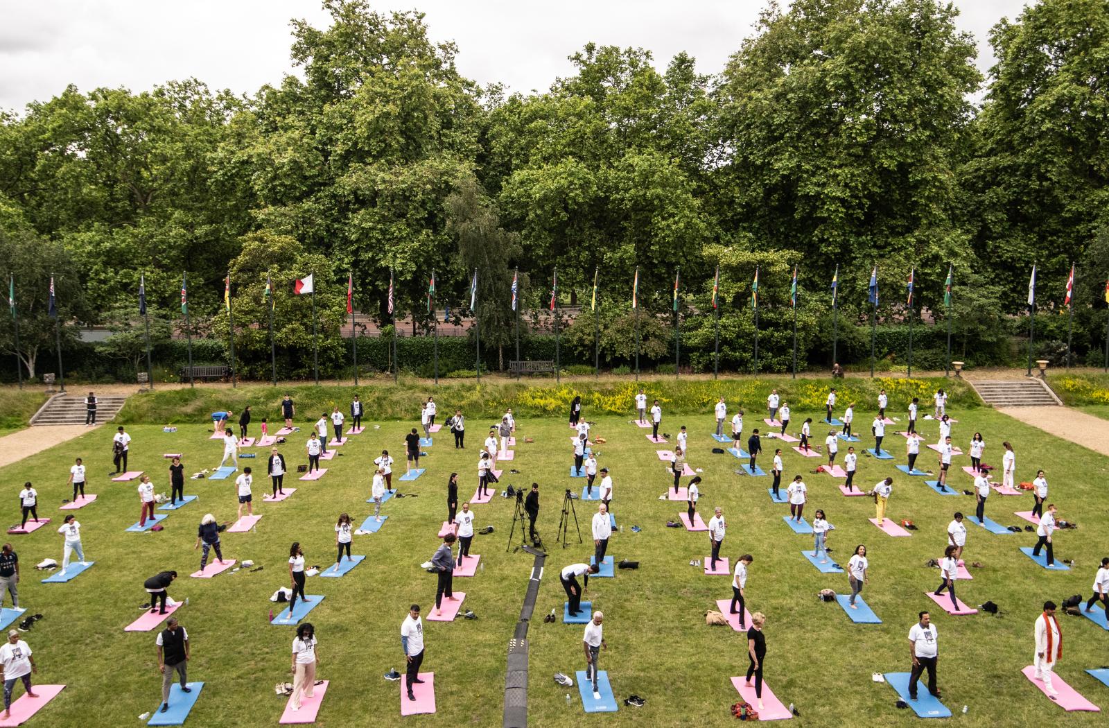 People-attend-yoga-on-the-front-lawn-of-marlborough-house
