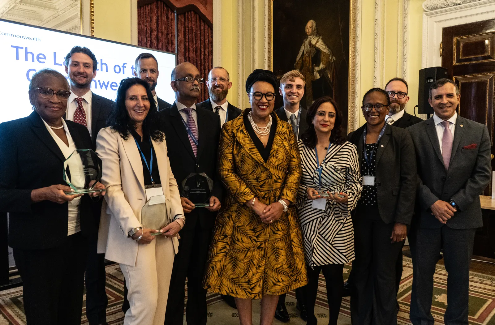 lawyers and award winners gather around SG for a photo