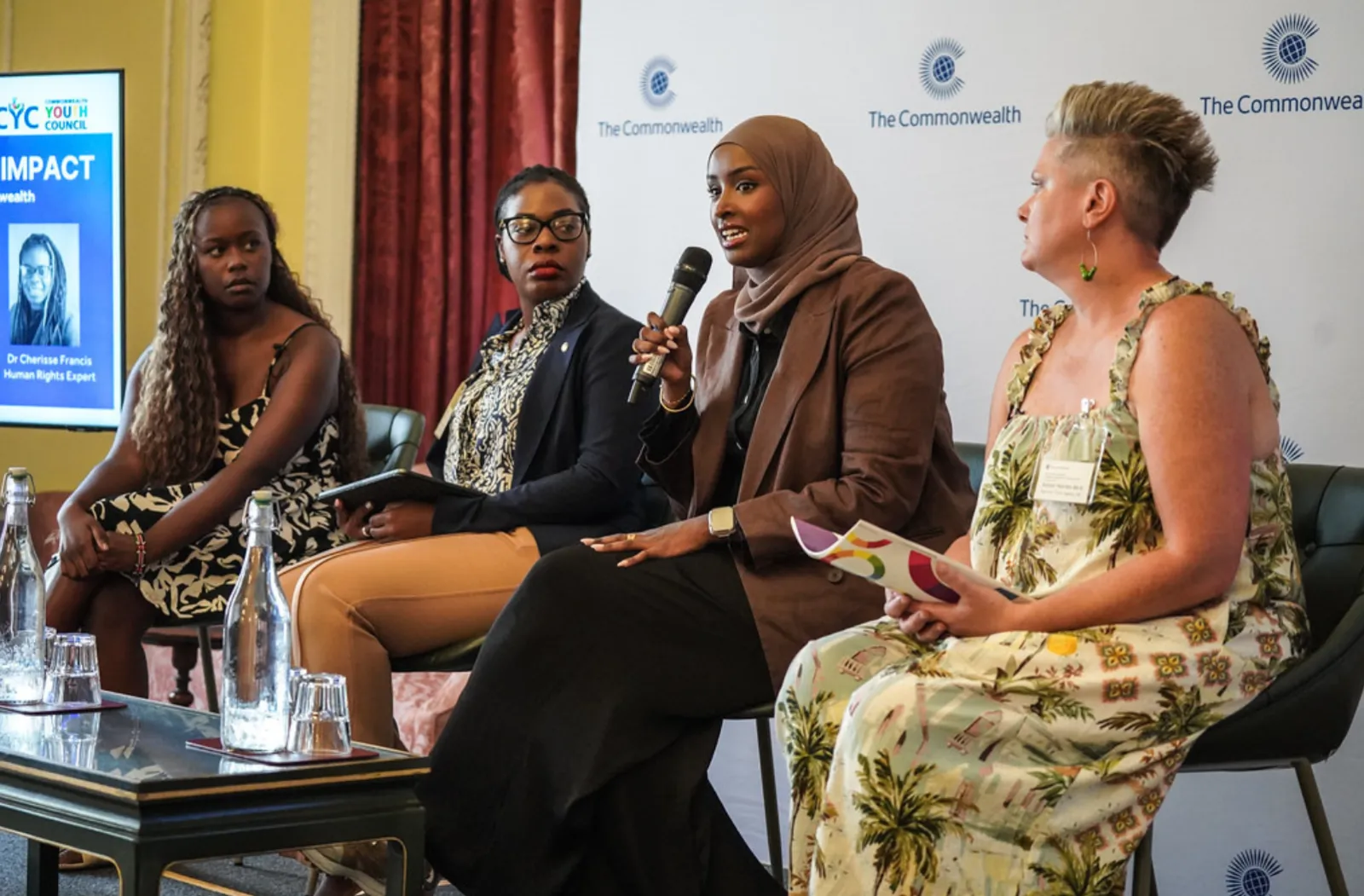 Four youth leaders speak on a panel for International Youth Day