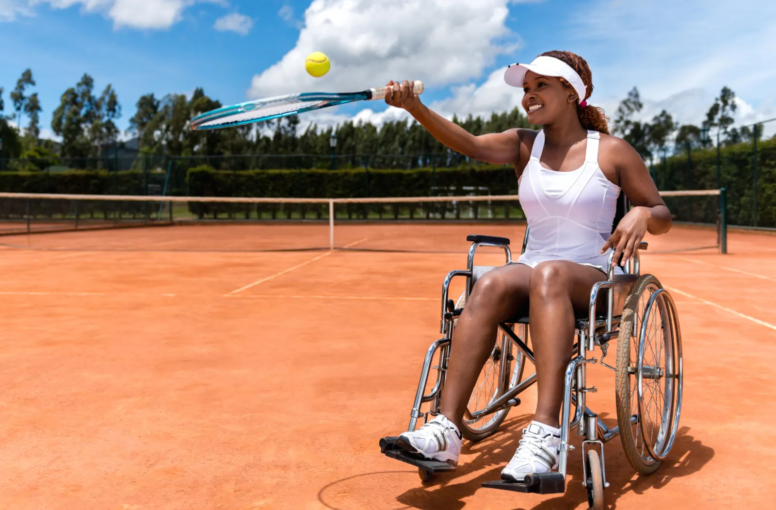 Paralympian plays tennis