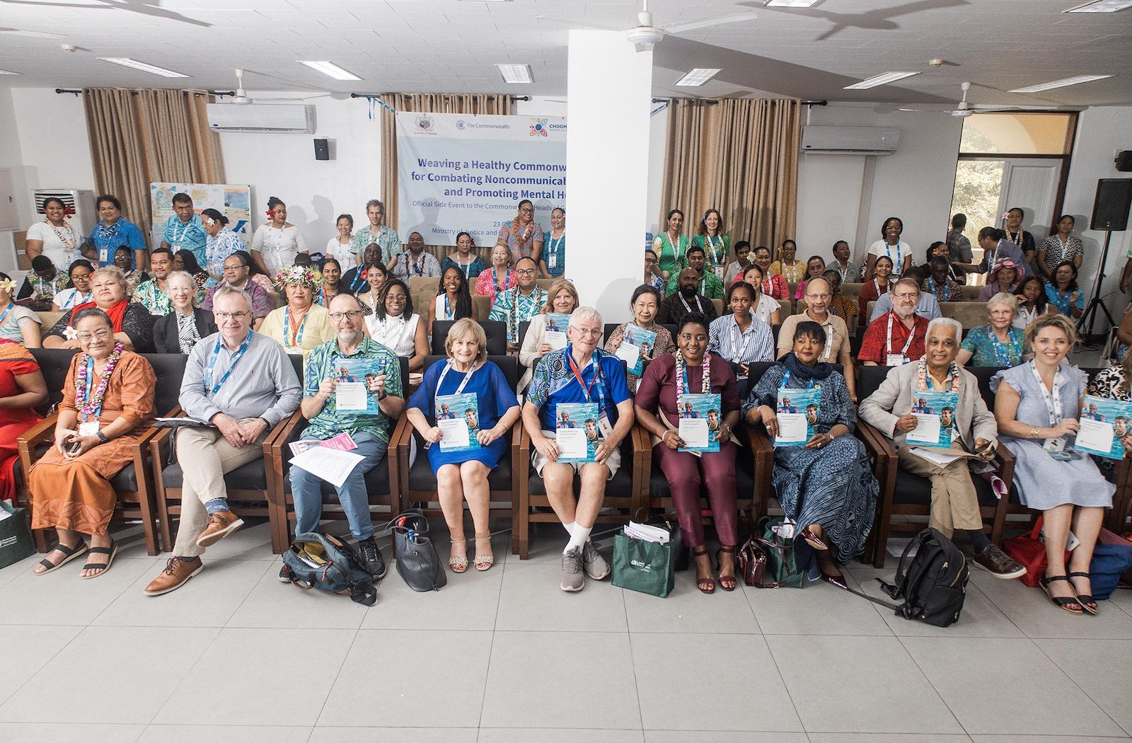 Group photo of participants at the NCDs and mental health side event for CHOGM 2024