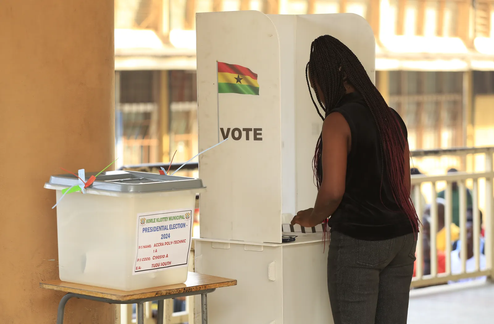 A voter casts her ballot in the 2024 Ghana elections