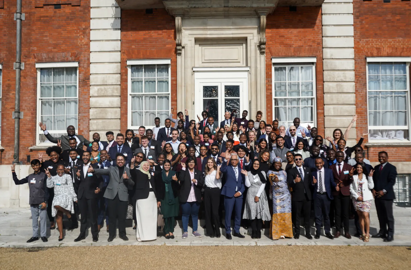Group photo of Commonwealth youth leaders on the steps outside Marlborough House
