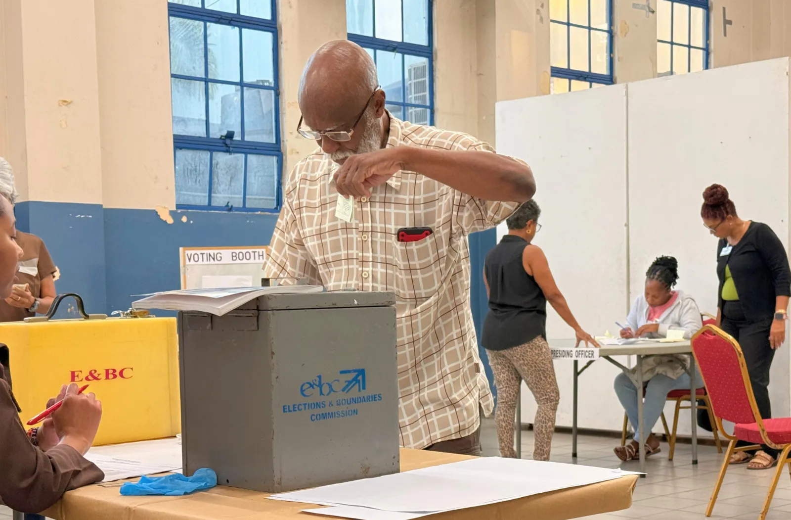 A man places his vote in the ballot the box during Trinidad and Tobago's 2025 Parliamentary Elections