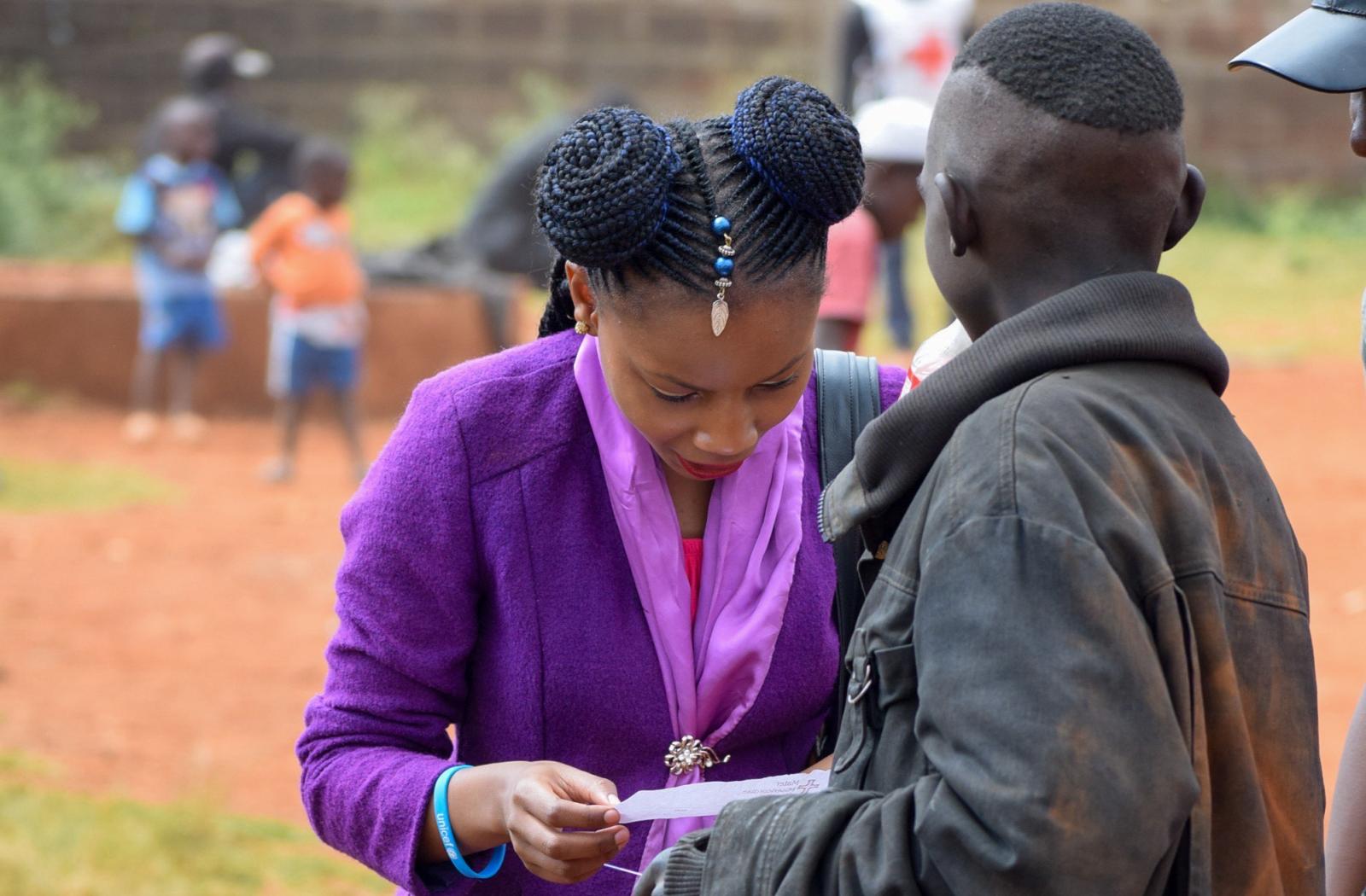 image of two people looking at a paper
